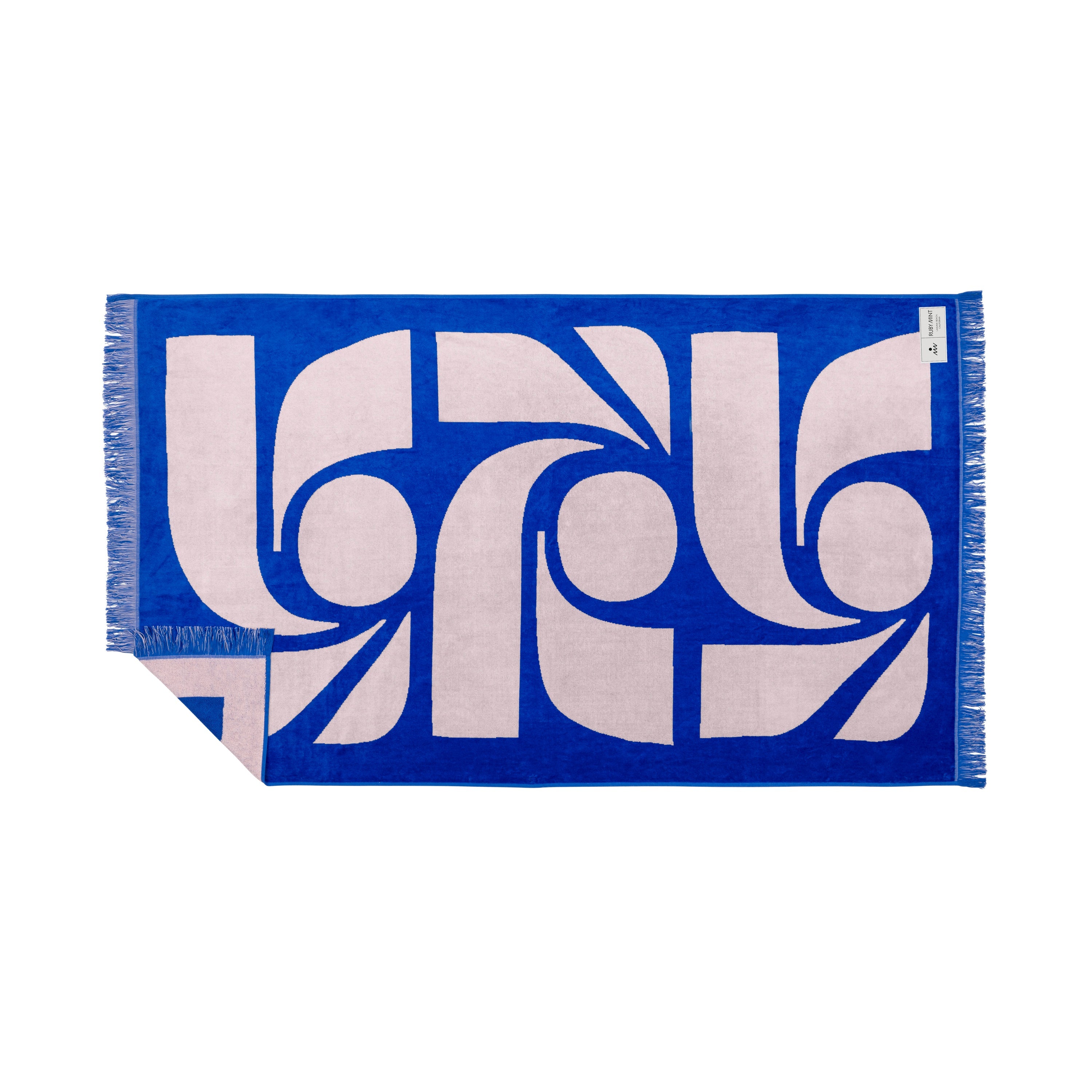 Blue and white patterned towel with fringe on a white background