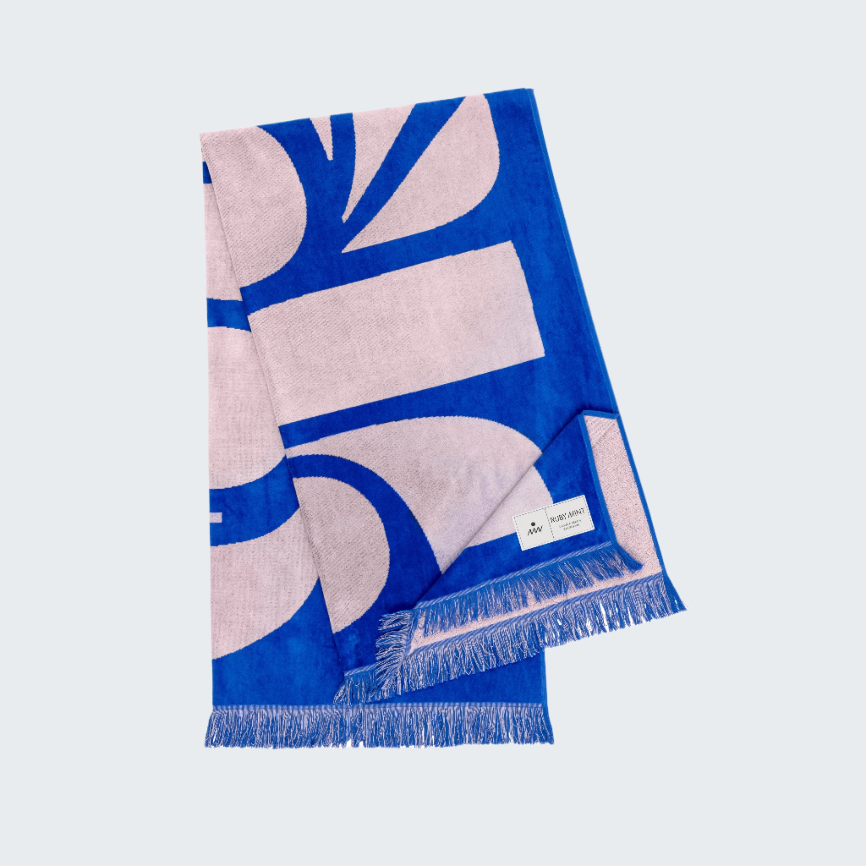 Blue and beige patterned scarf with a brand label on a white background