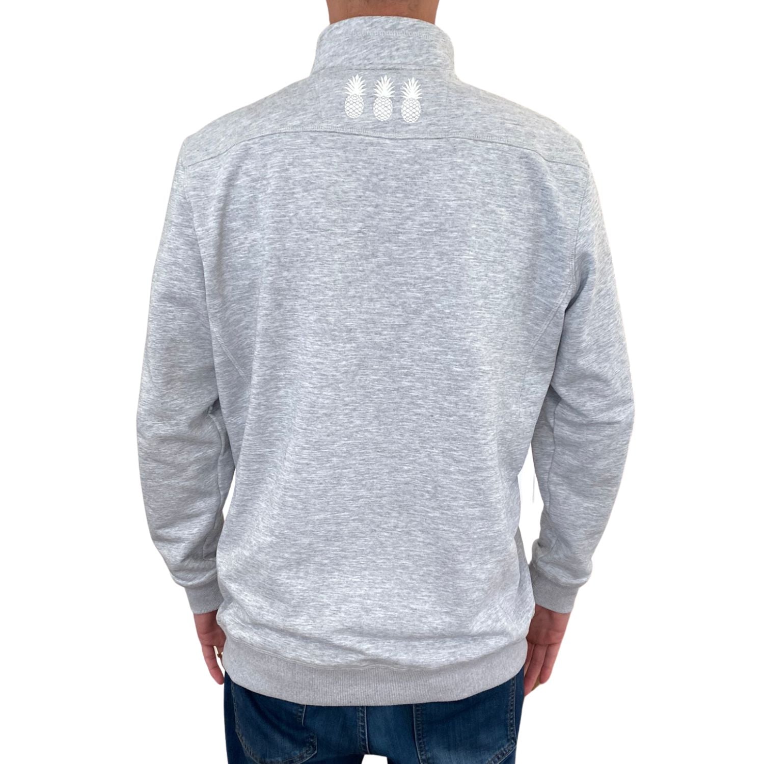 Gray quarter-zip sweatshirt with white pineapple designs on the back, worn by a person.