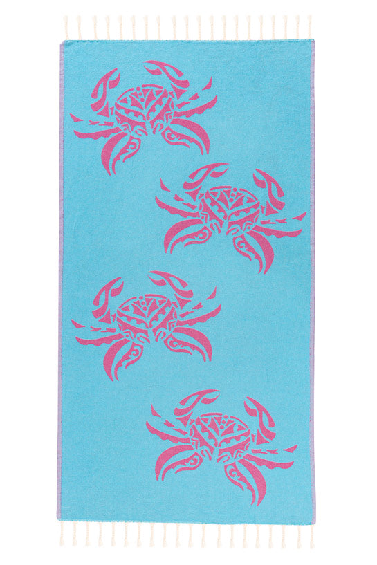 Blue towel with pink crab patterns on a white background