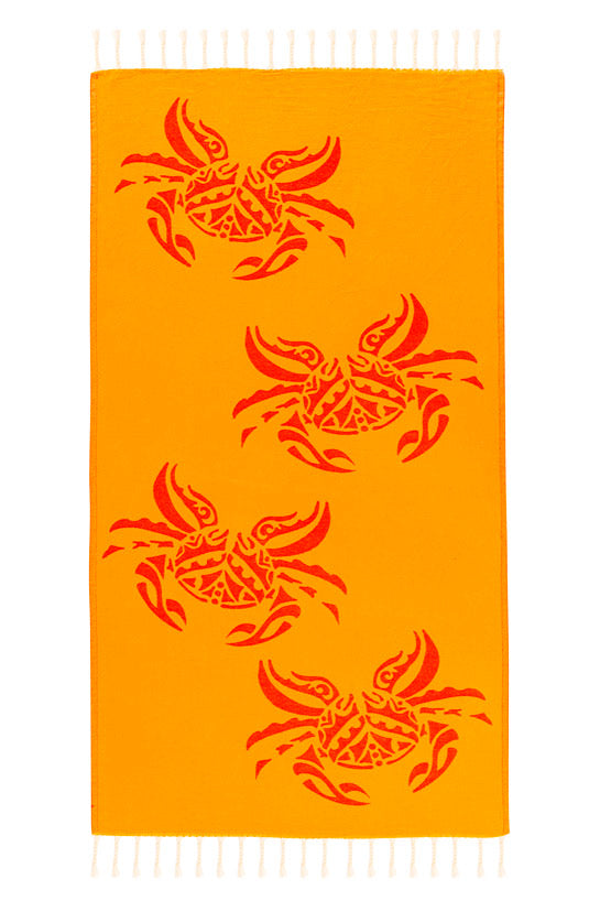Orange towel with red crab patterns on a white background