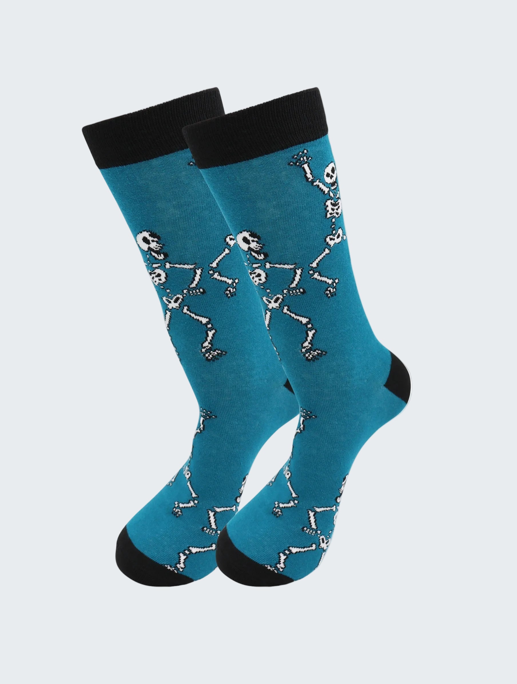 Blue socks with skeleton design and black cuffs on a white background