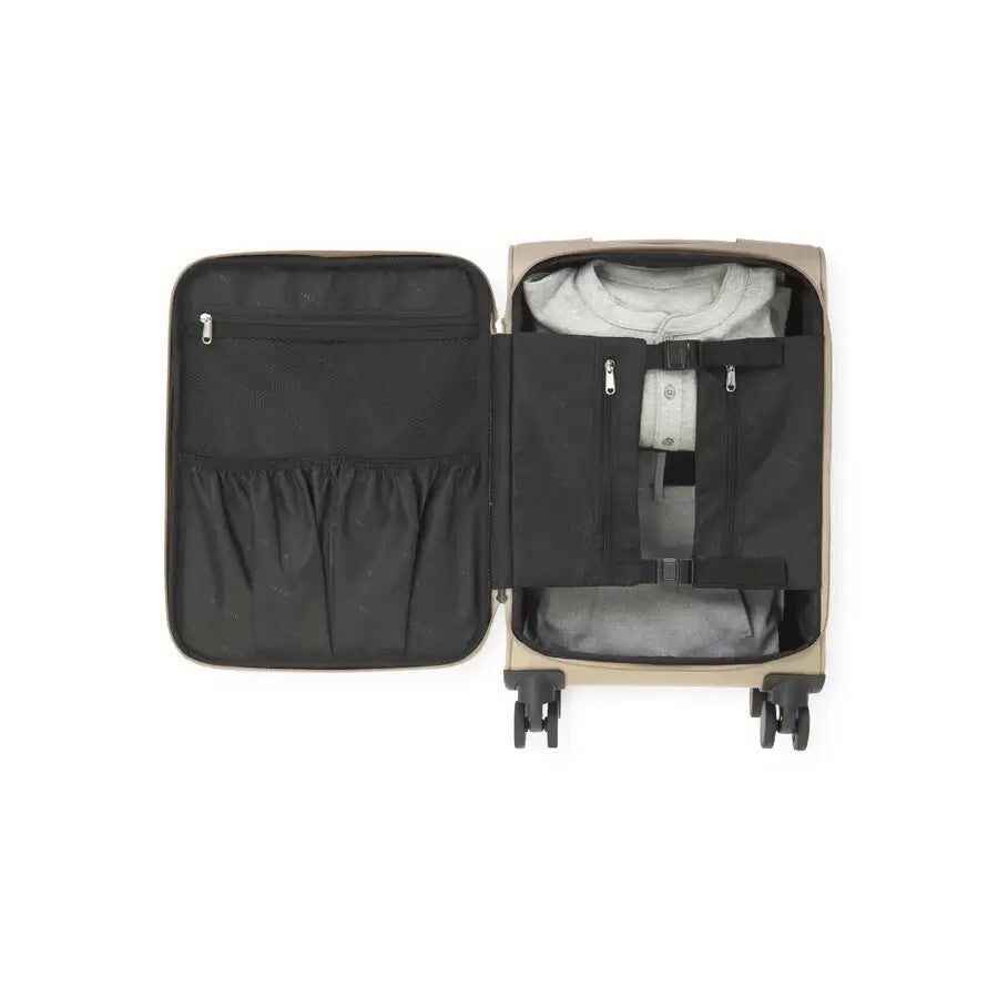 Open suitcase with clothes inside on a white background