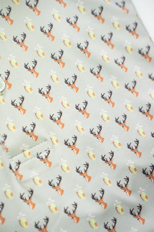 Patterned fabric with deer antlers and candy corn on a light gray background