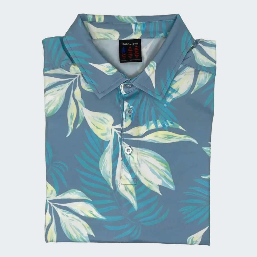 Tropical leaf patterned shirt on a green grass background