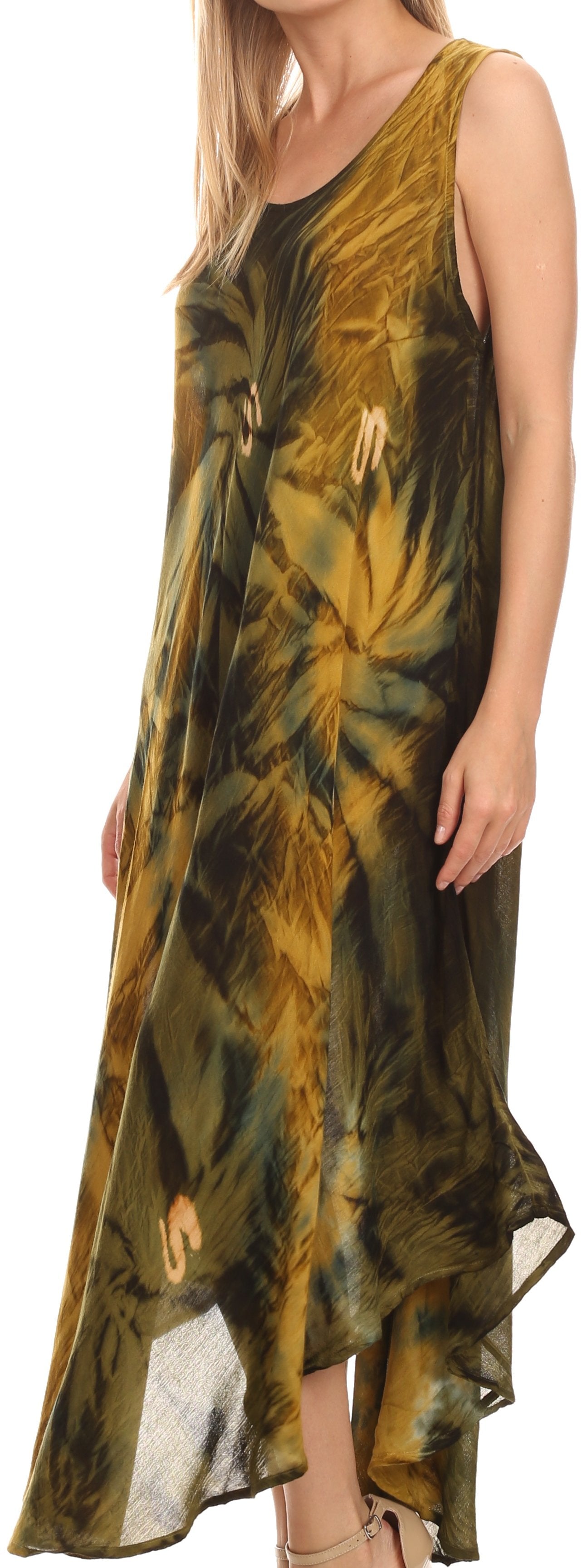 Woman wearing a sleeveless, tie-dye dress with a green and yellow pattern.