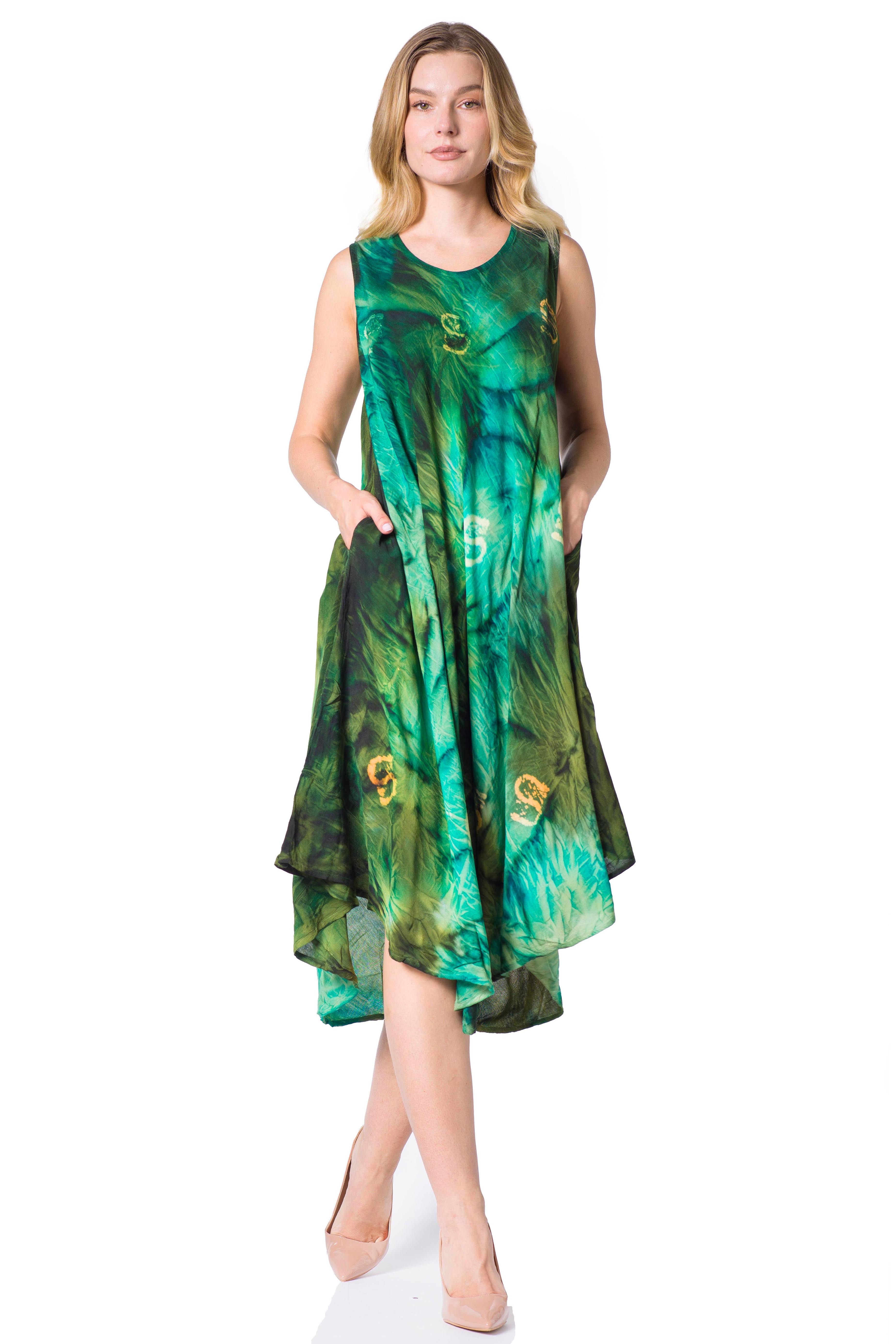 Woman wearing a green patterned dress on a white background