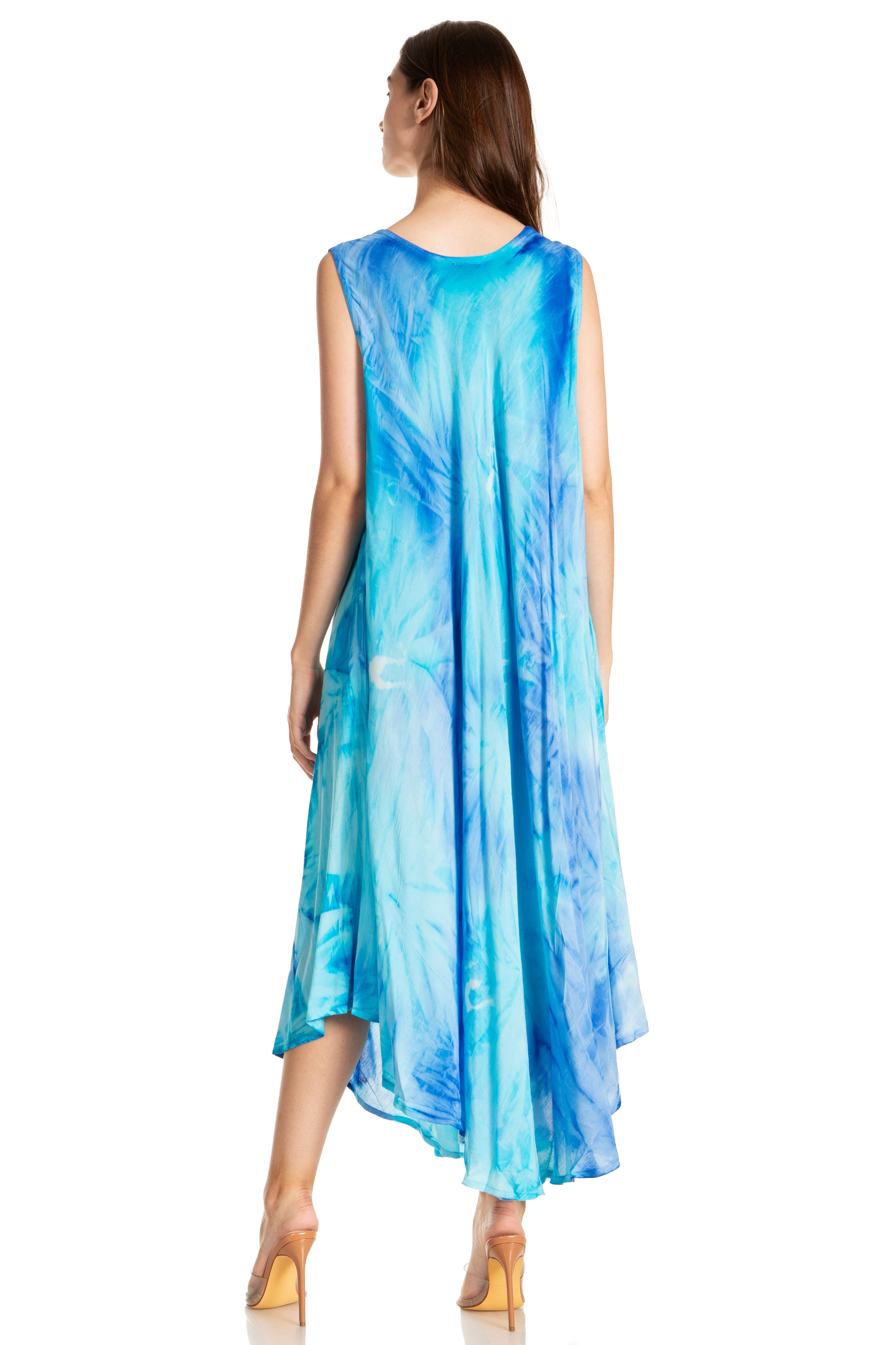 Woman wearing a blue tie-dye dress on a white background