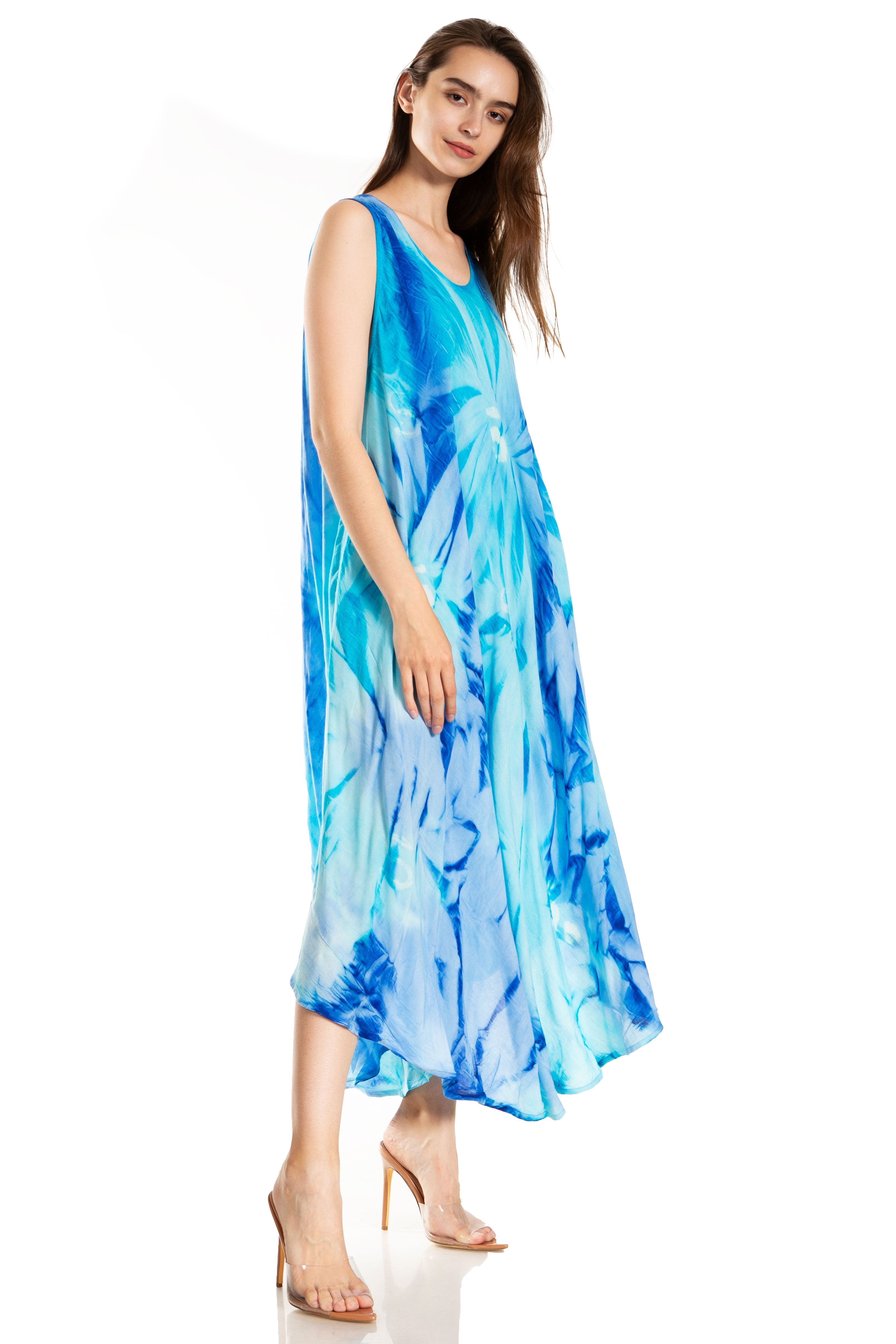 Woman wearing a blue tie-dye dress on a white background