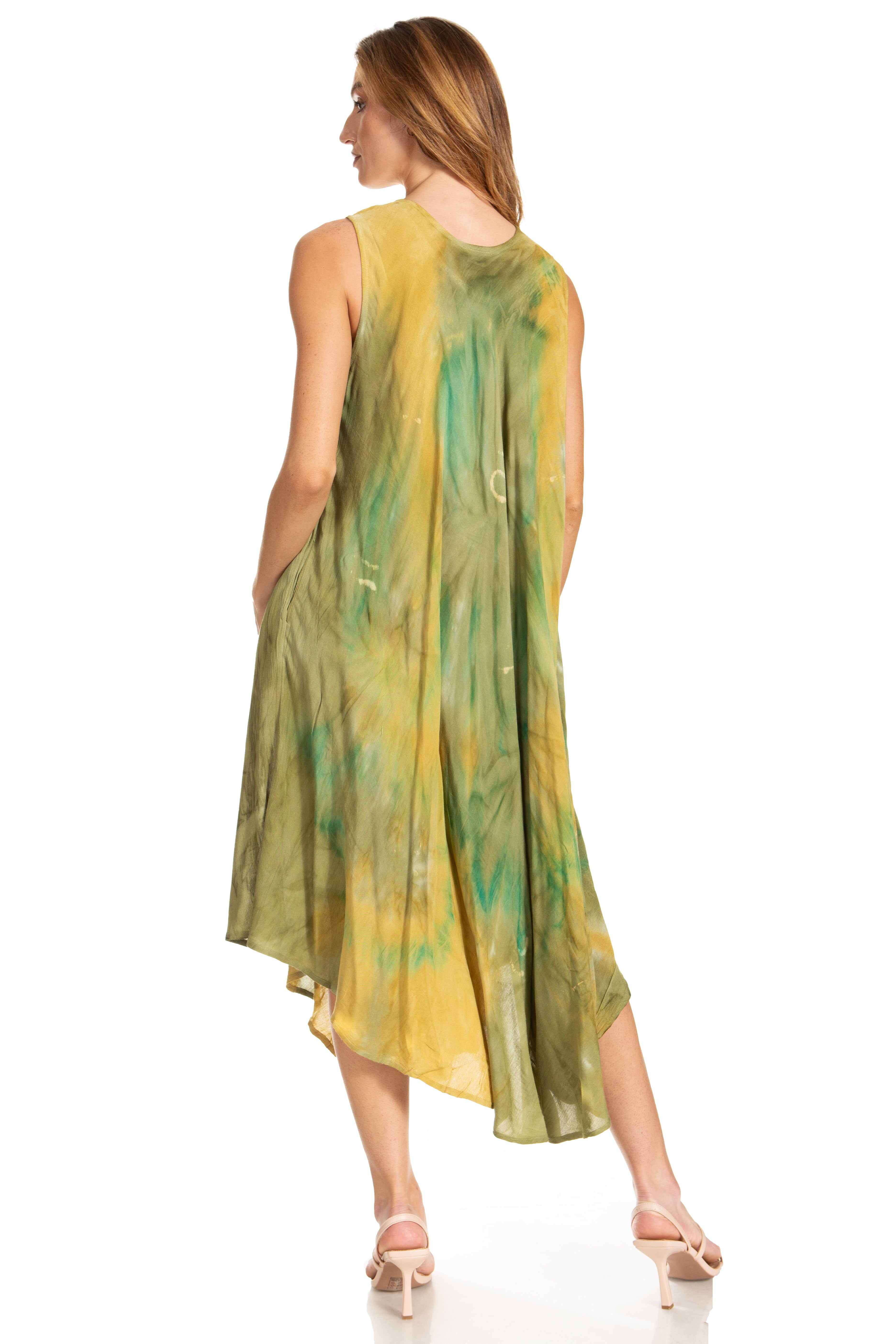 Woman wearing a green and yellow tie-dye dress on a white background