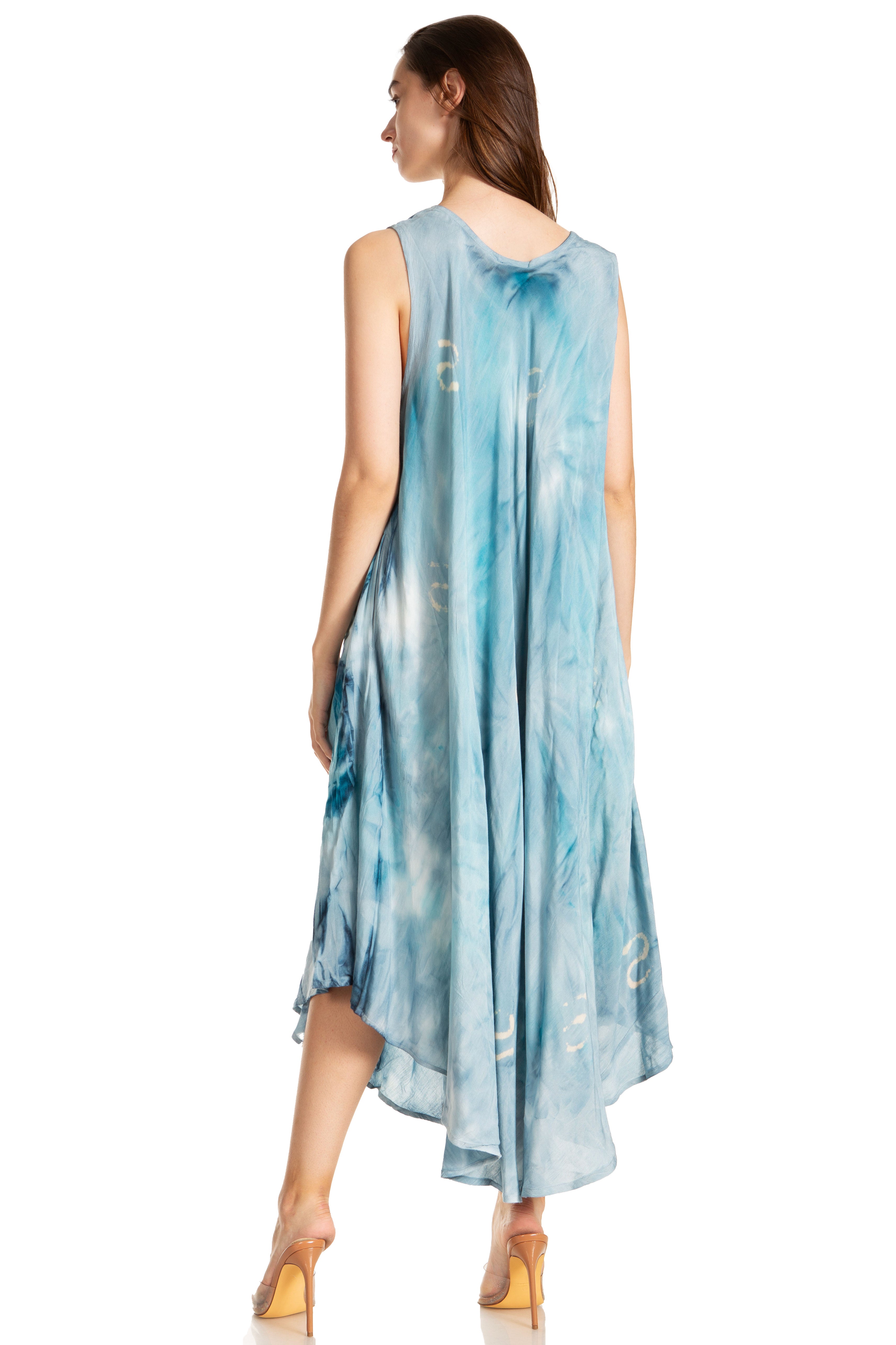 Woman wearing a blue tie-dye dress on a white background