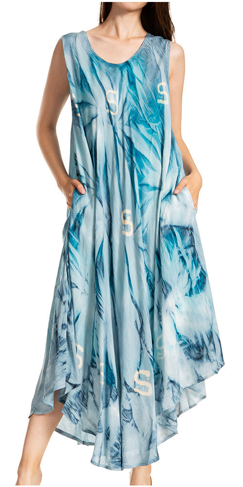 Woman wearing a blue tie-dye dress with a pattern on a white background
