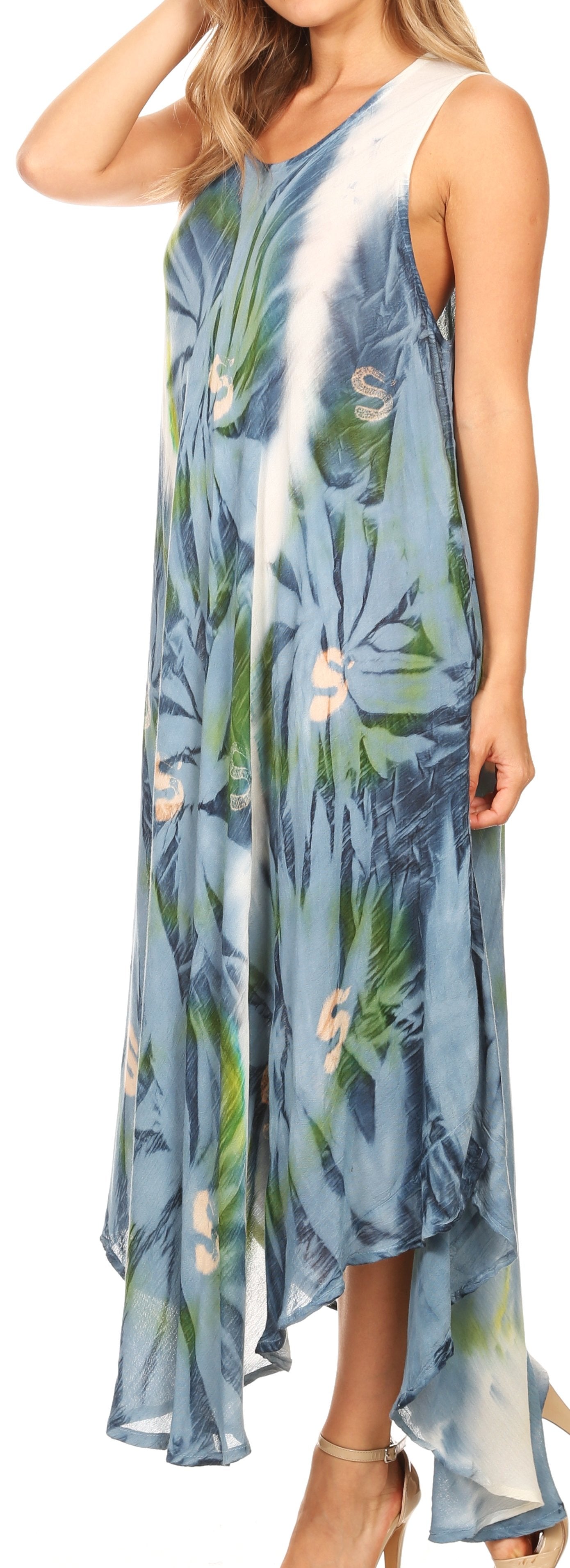 Woman wearing a blue floral dress with a white strap over her shoulder.