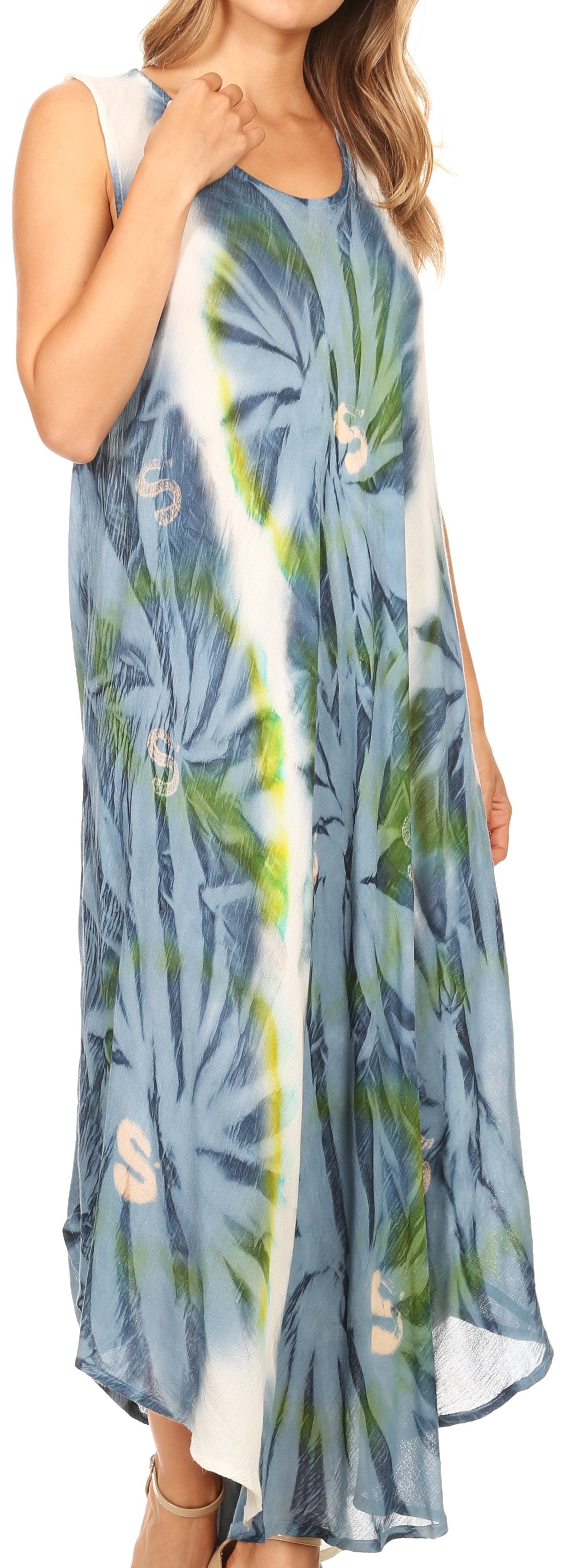 Woman wearing a blue floral dress with a white strap over her shoulder.