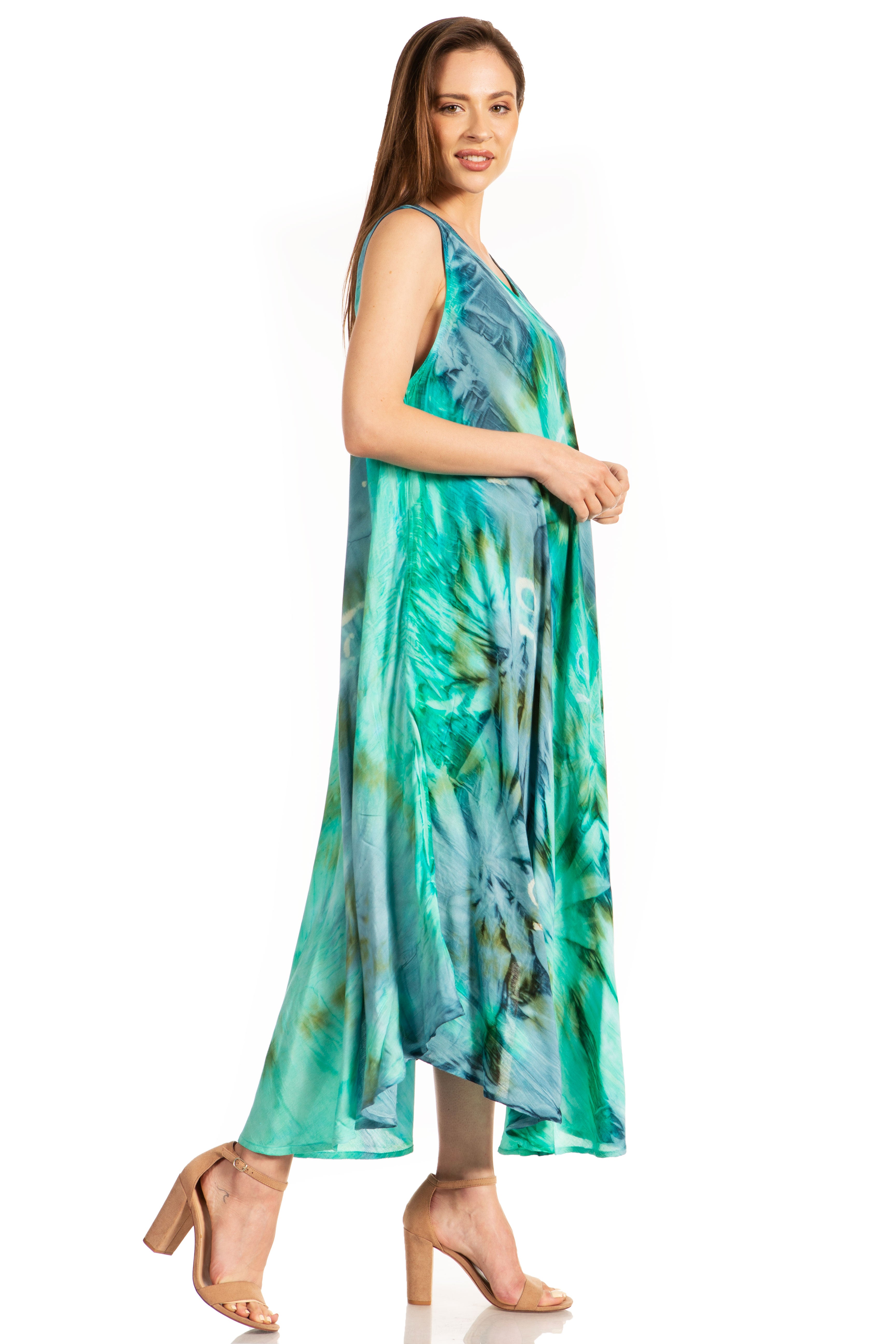 Woman wearing a green and blue patterned dress on a white background