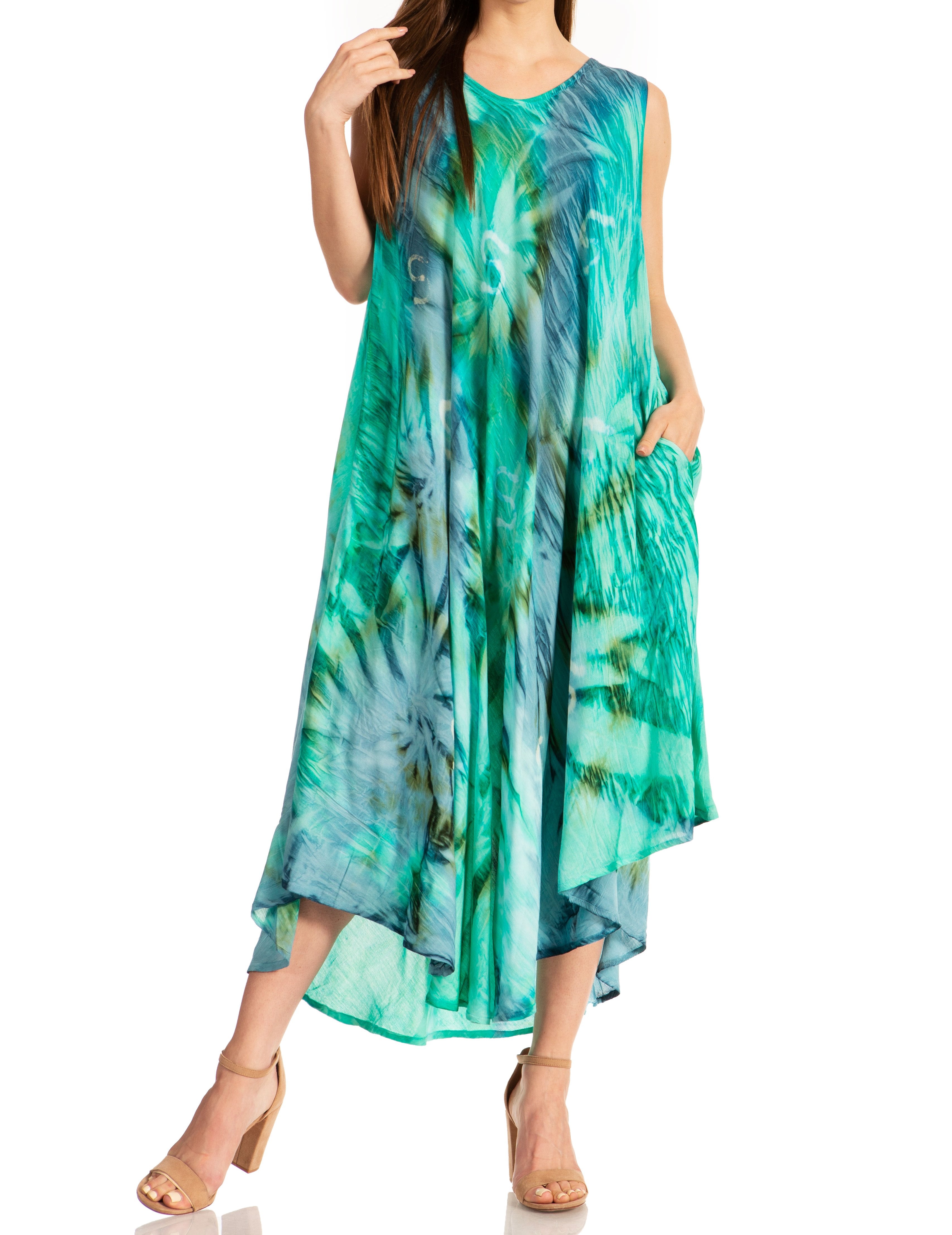 Woman wearing a sleeveless, tie-dye dress with a white background