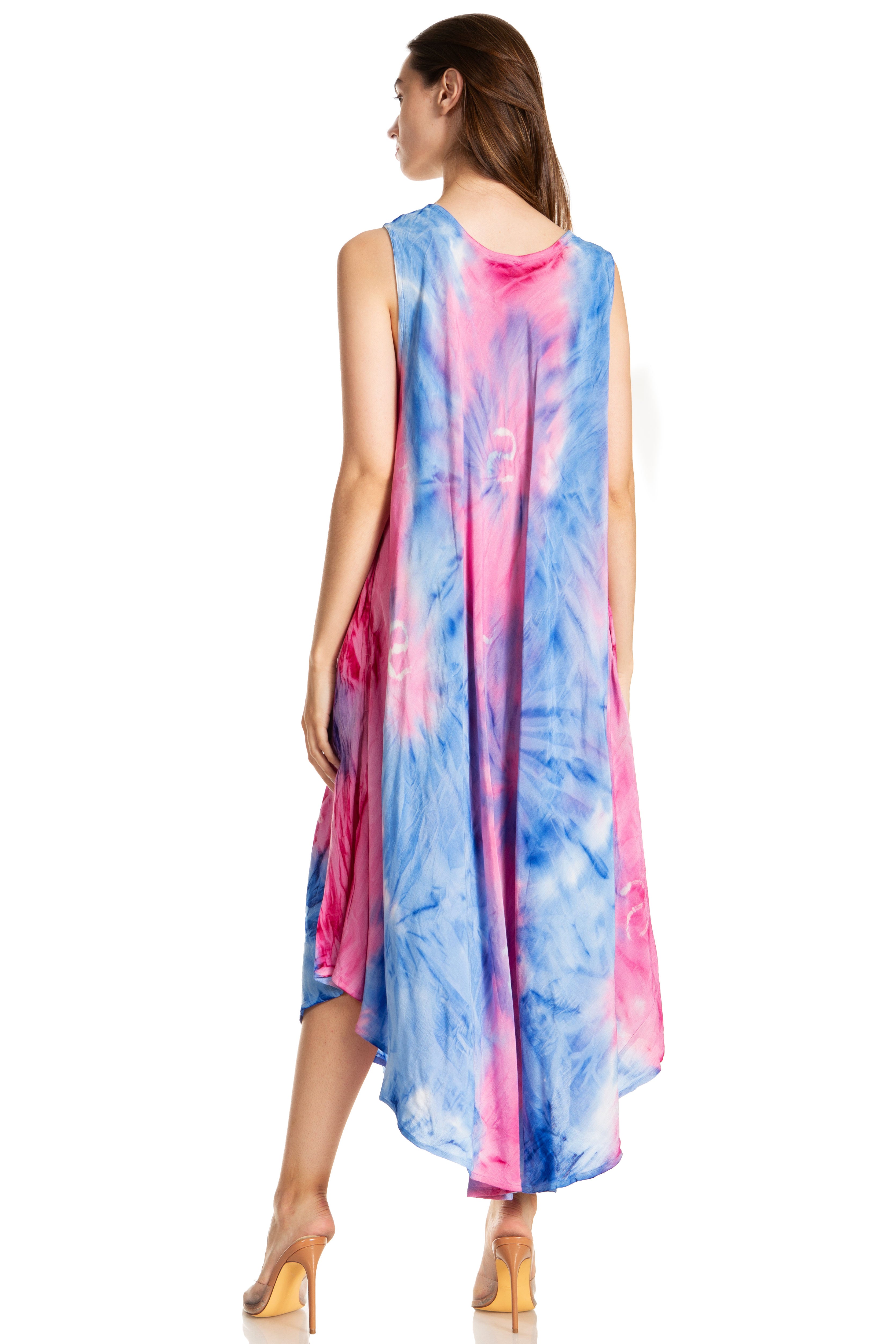 Woman wearing a tie-dye dress with pink and blue patterns on a white background