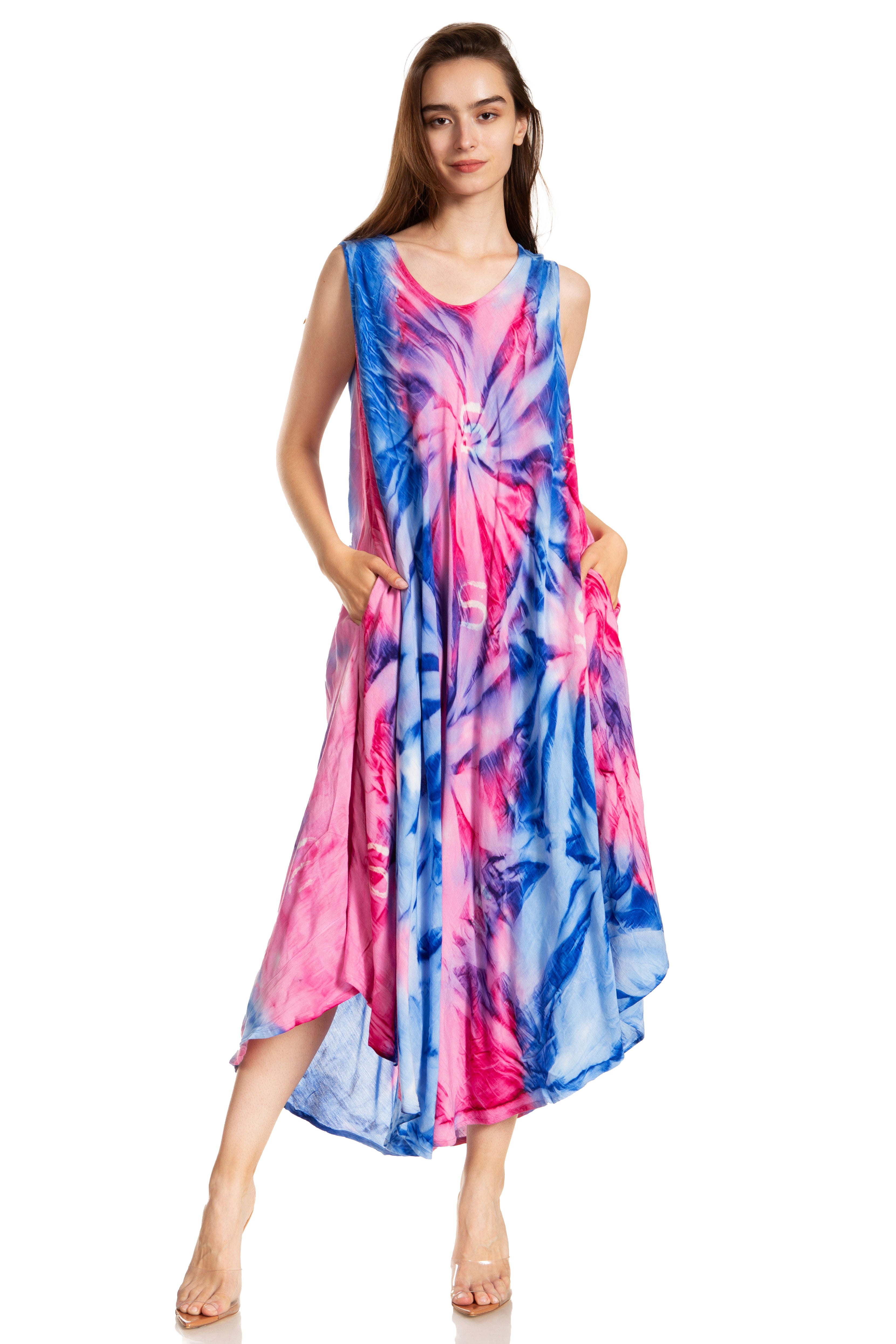 Woman wearing a tie-dye dress with pink and blue patterns on a white background