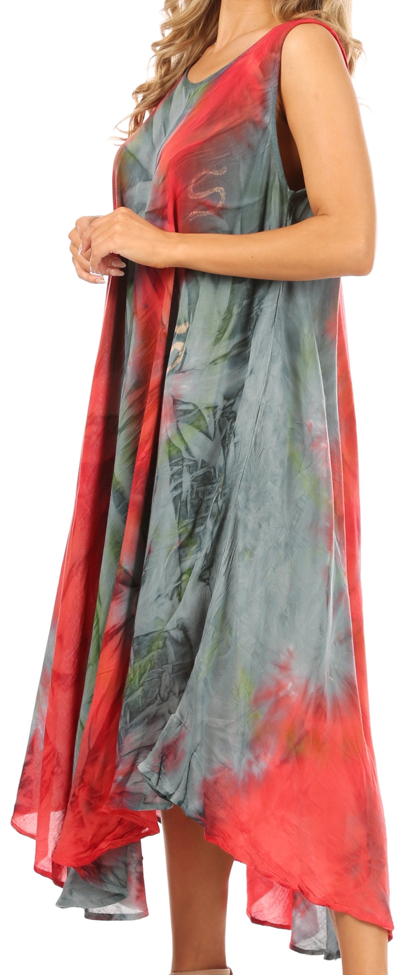 Woman wearing a long, colorful dress with a floral pattern on a white background
