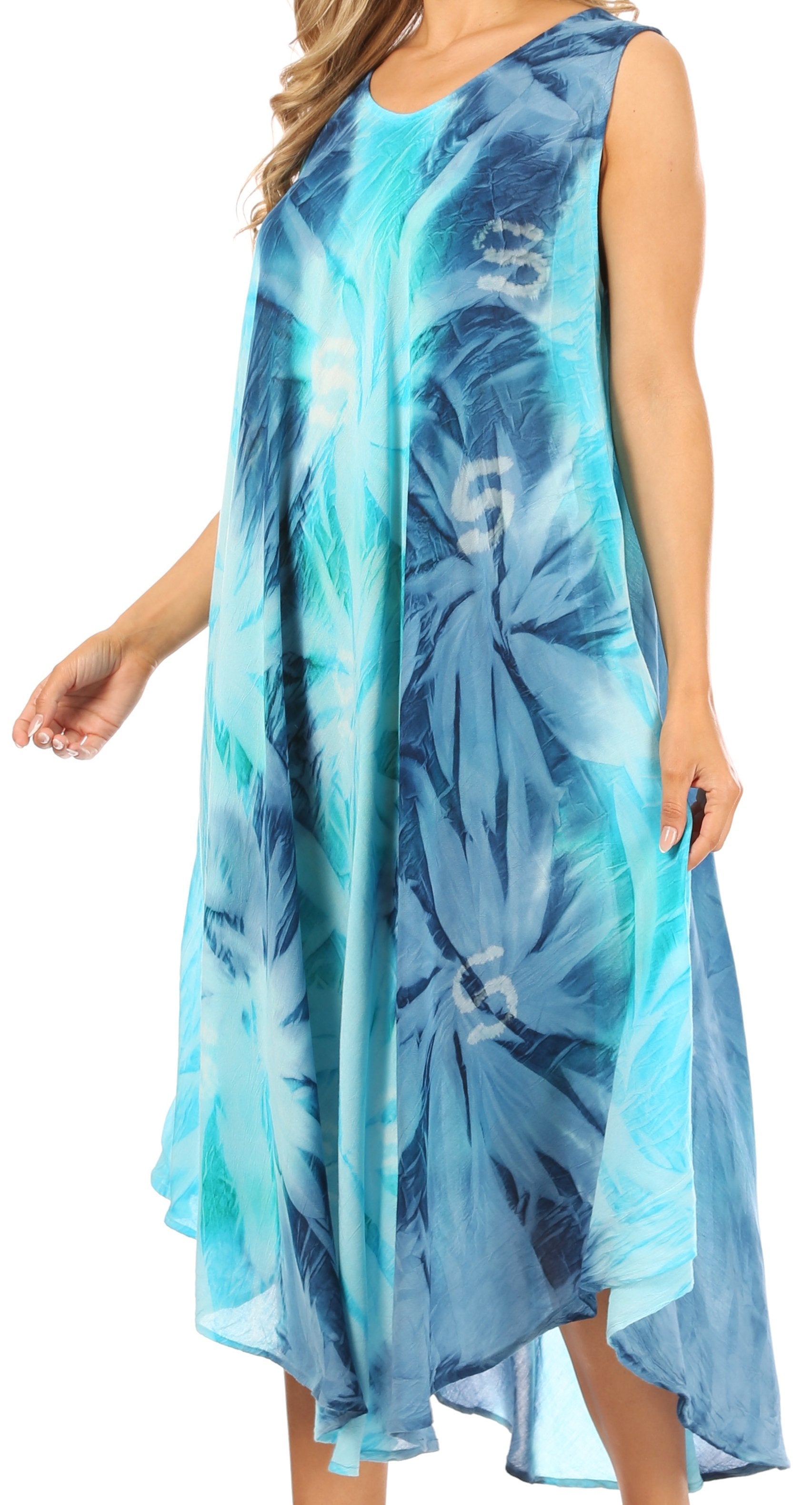 Woman wearing a blue and green leaf-patterned dress on a white background