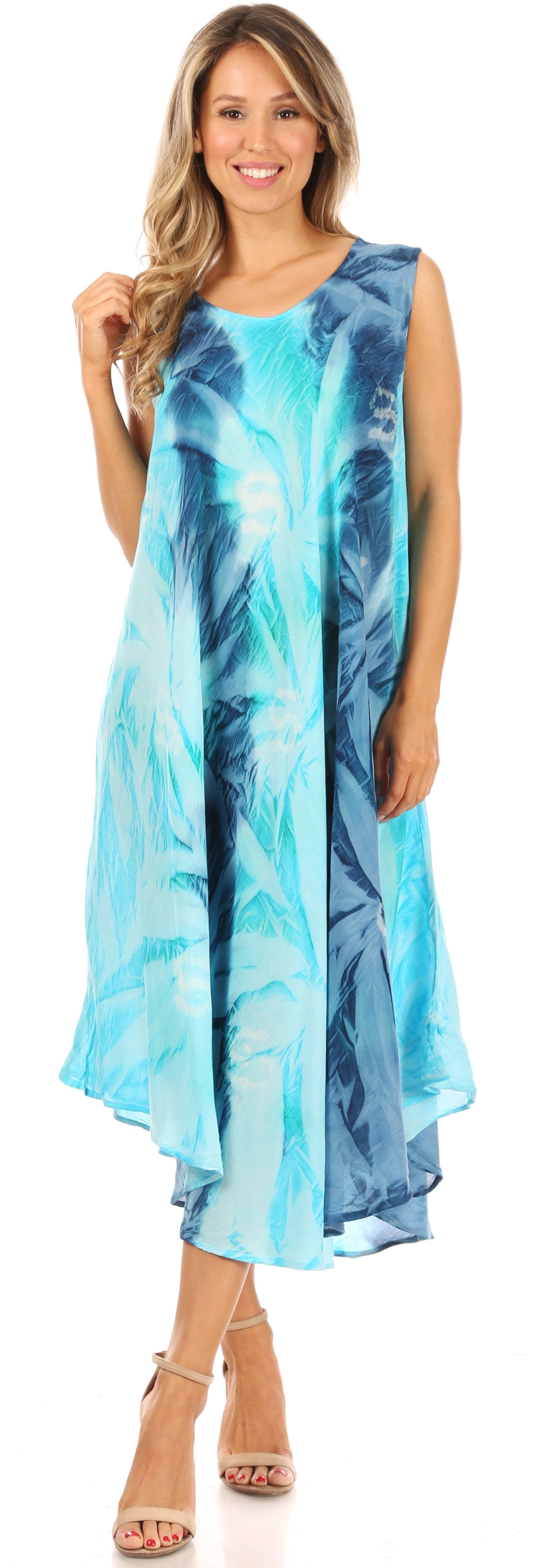 Woman wearing a blue and green patterned dress against a white background