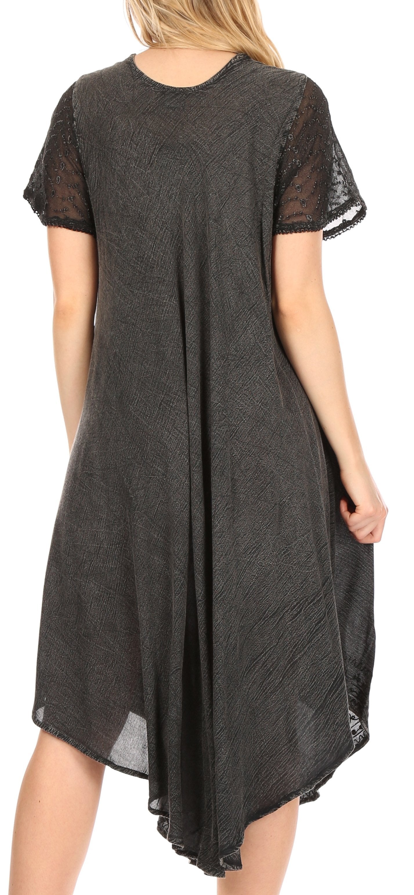 Black dress with sheer sleeves and bottom hem on a model