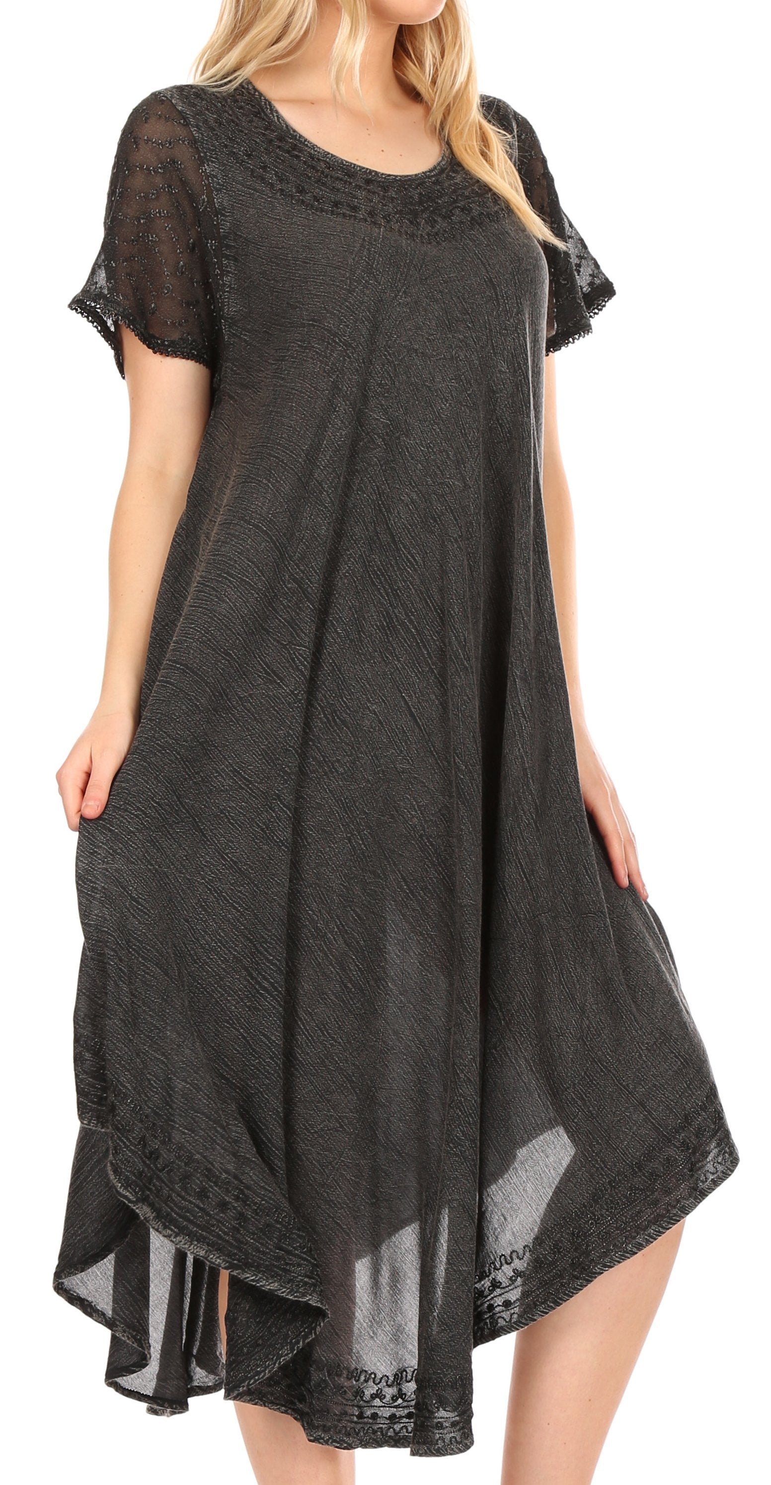 Black dress with sheer sleeves and bottom hem on a white background