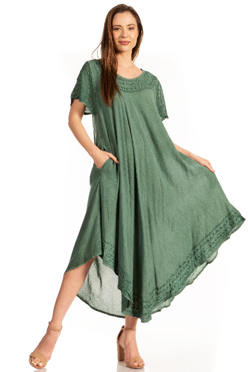 Woman wearing a green dress with lace details on a white background