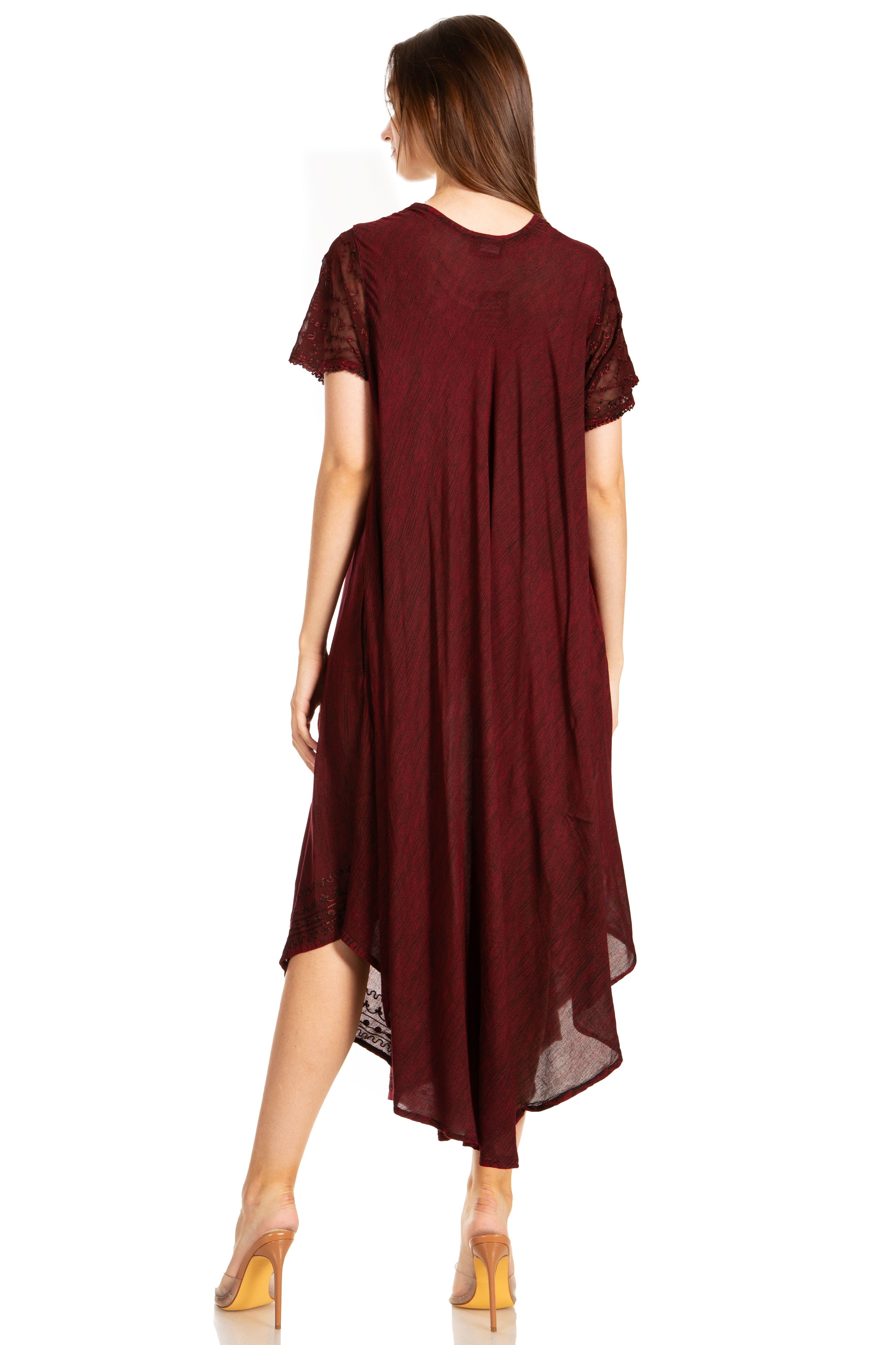 Woman wearing a burgundy dress on a white background