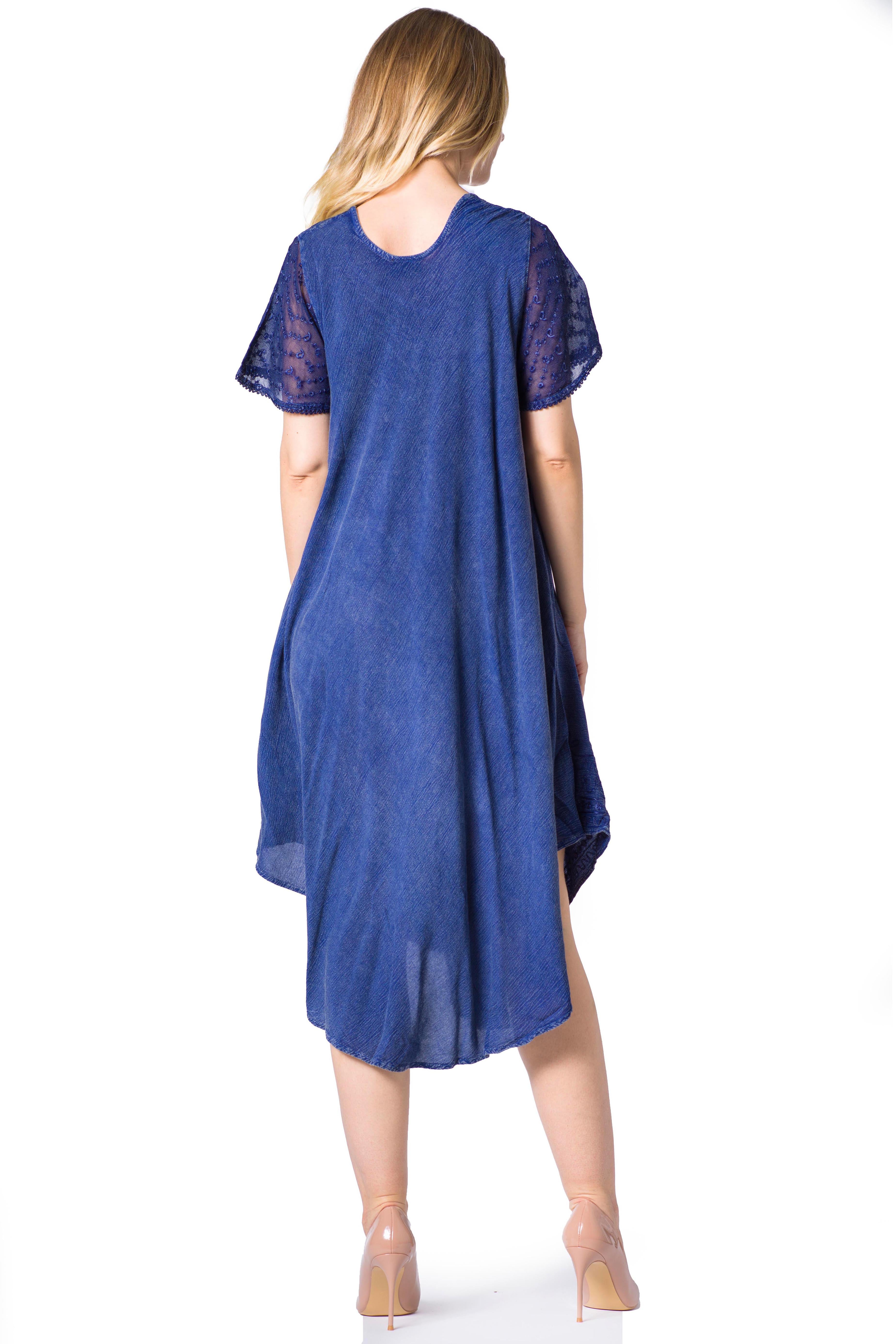 Woman wearing a blue dress with lace sleeves on a white background