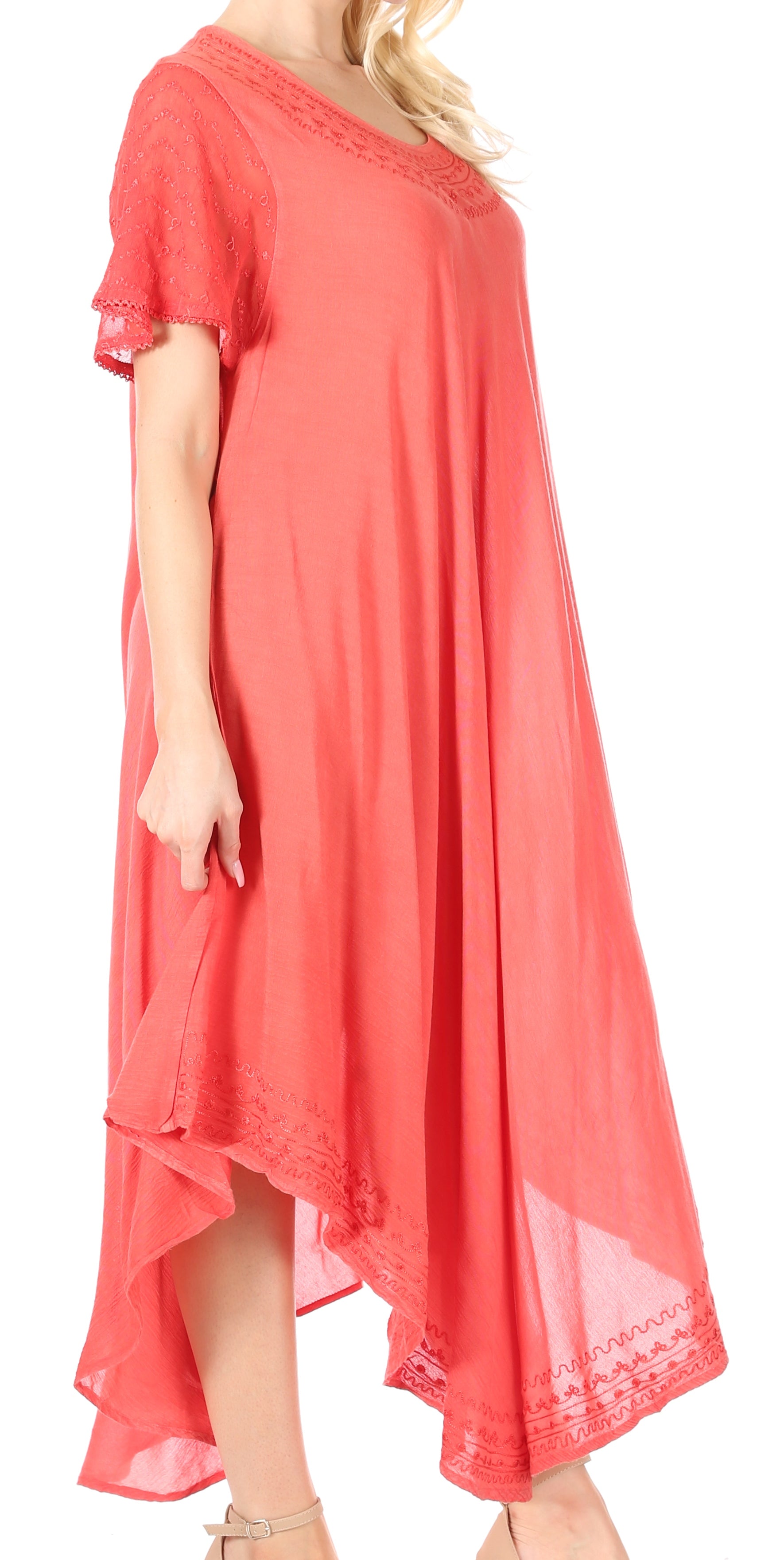 Coral dress with lace details on a white background