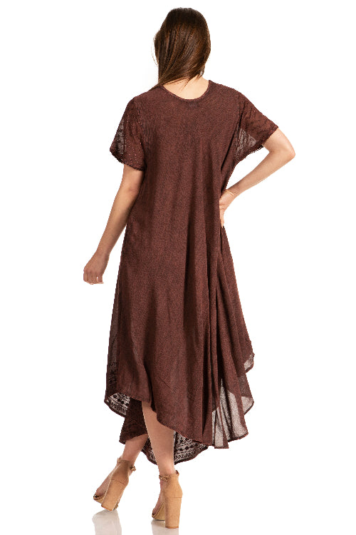 Woman wearing a brown dress with lace details on a white background