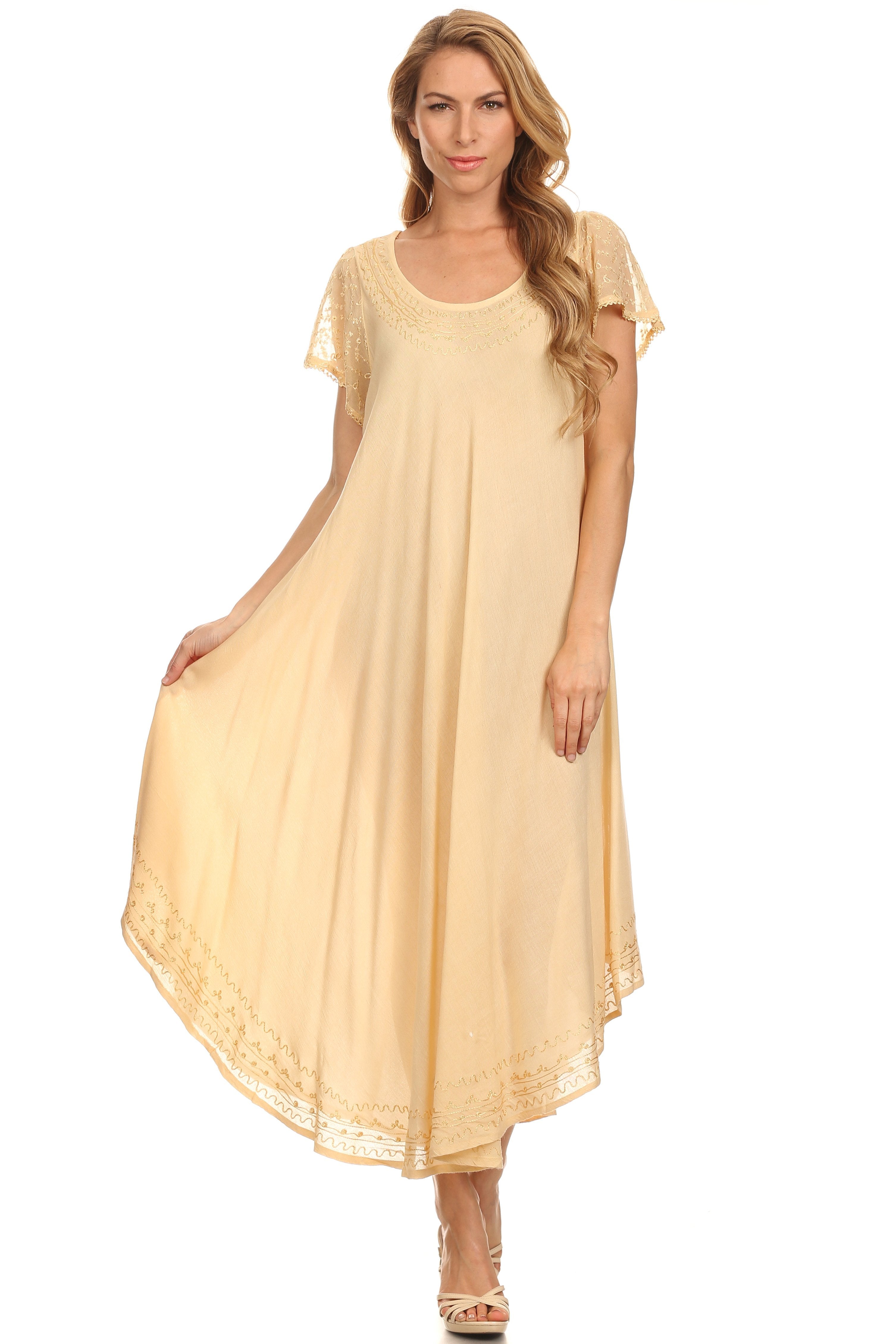 Woman wearing a beige long dress on a white background