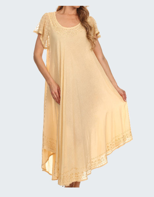 Woman wearing a light yellow dress with lace sleeves on a white background