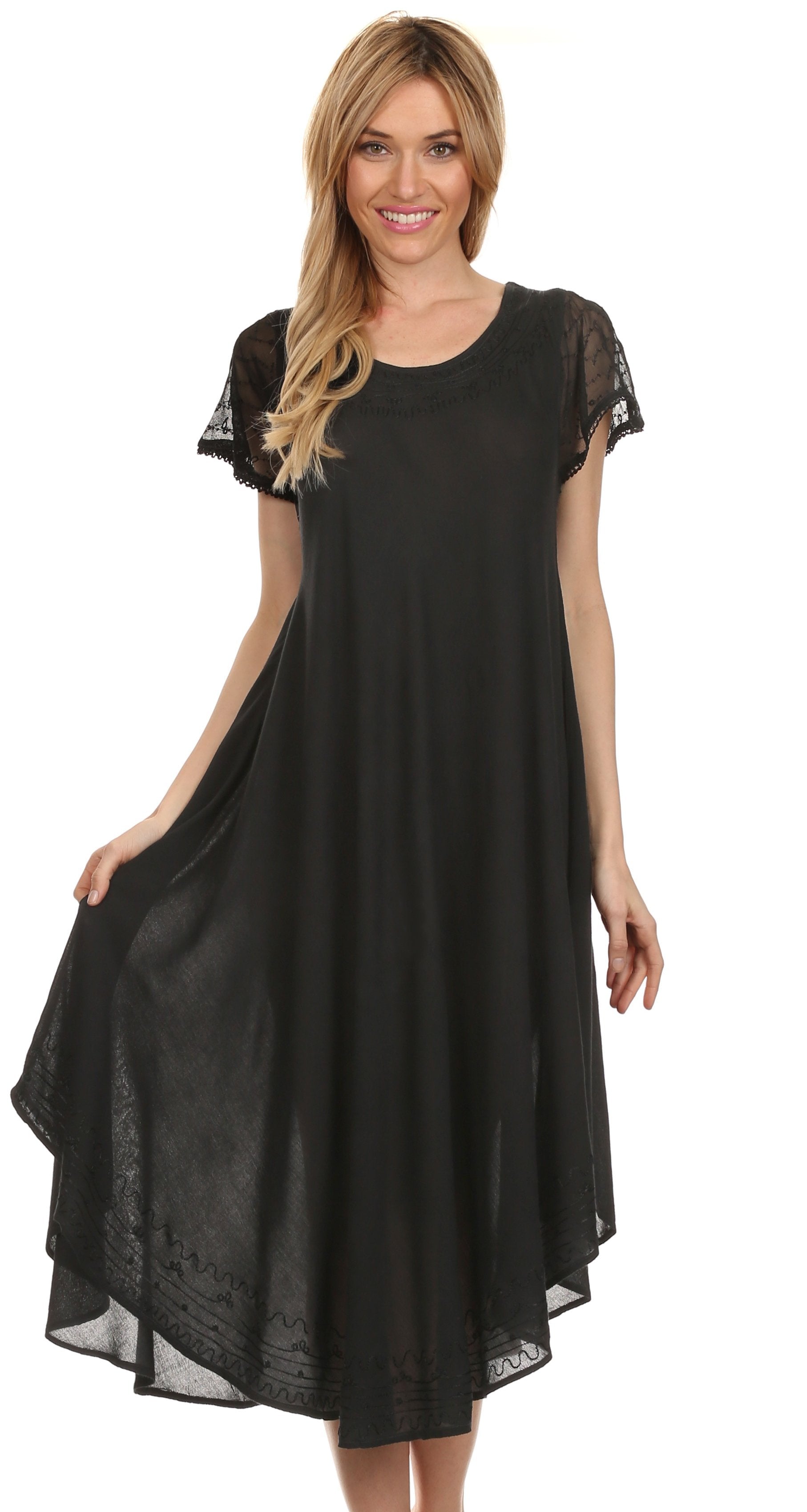 Woman wearing a black dress with lace sleeves on a white background