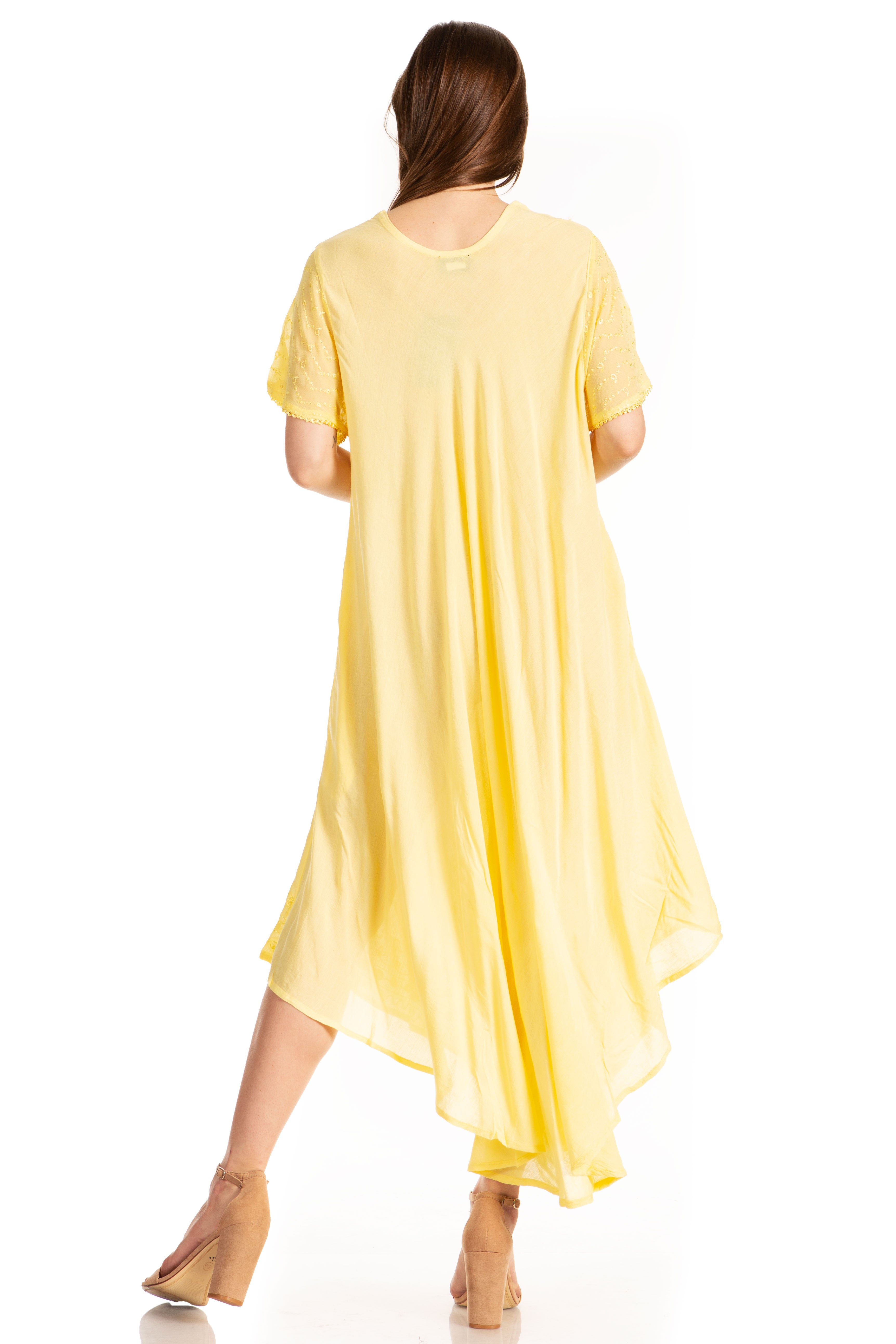 Woman wearing a yellow dress on a white background