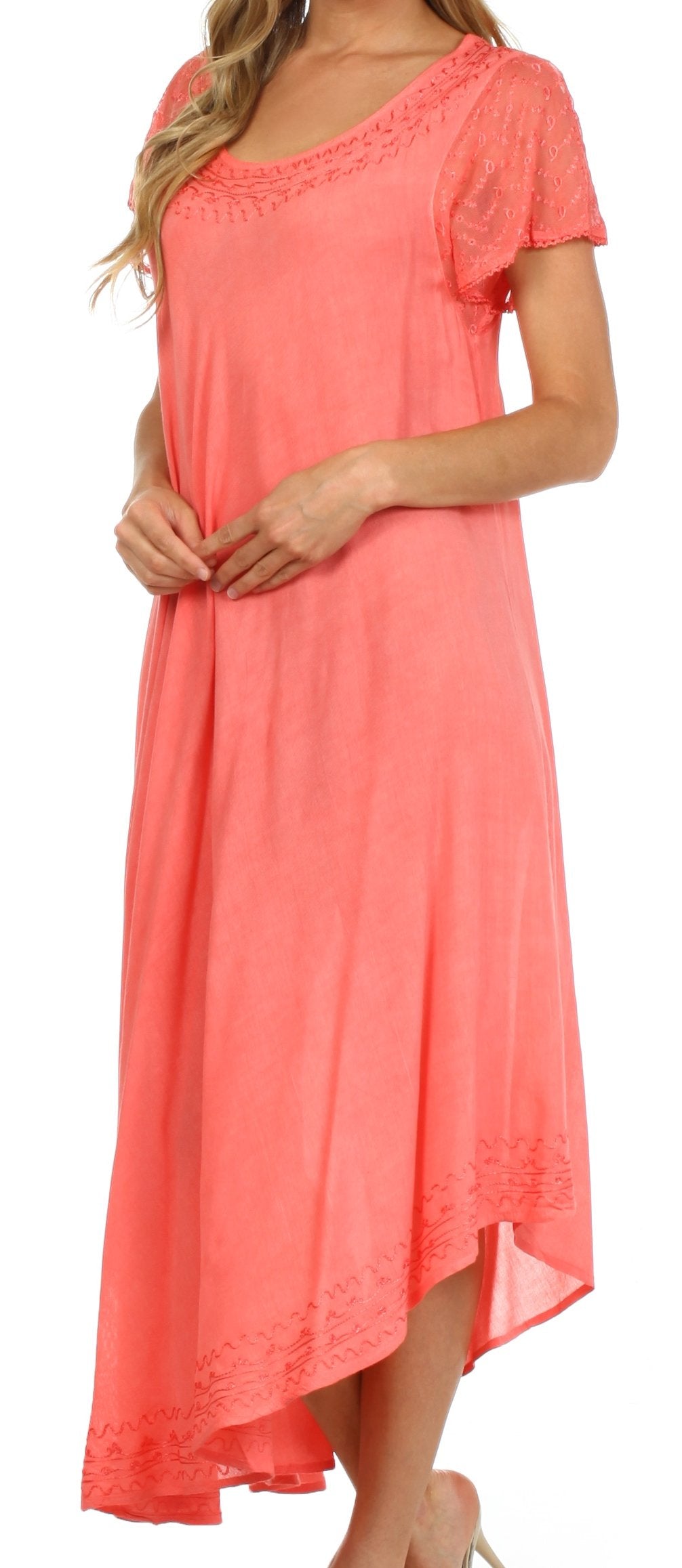 Coral dress worn by a model on a white background