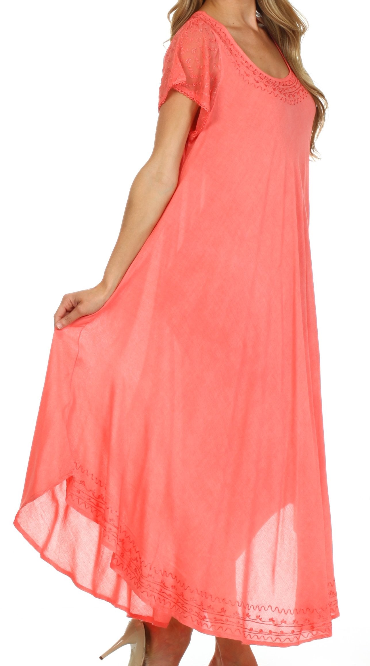 Coral dress with lace details on a white background