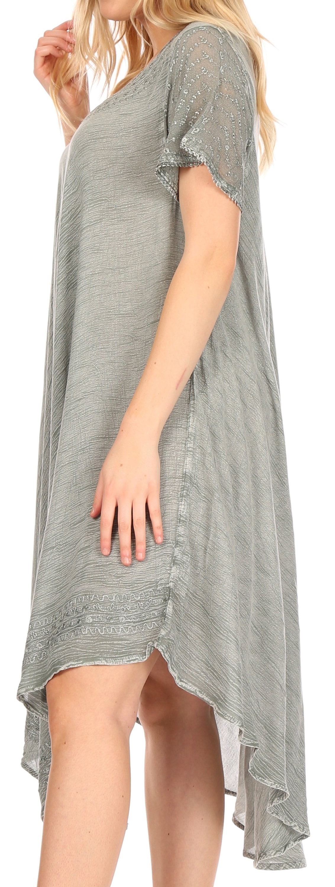 Woman wearing a gray dress with a white background