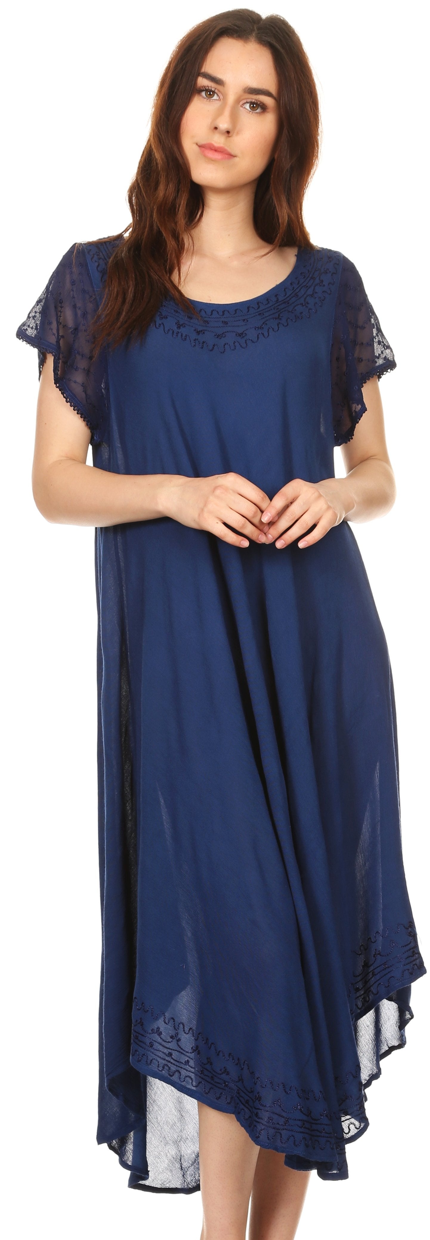 Woman wearing a blue dress with lace details on a white background