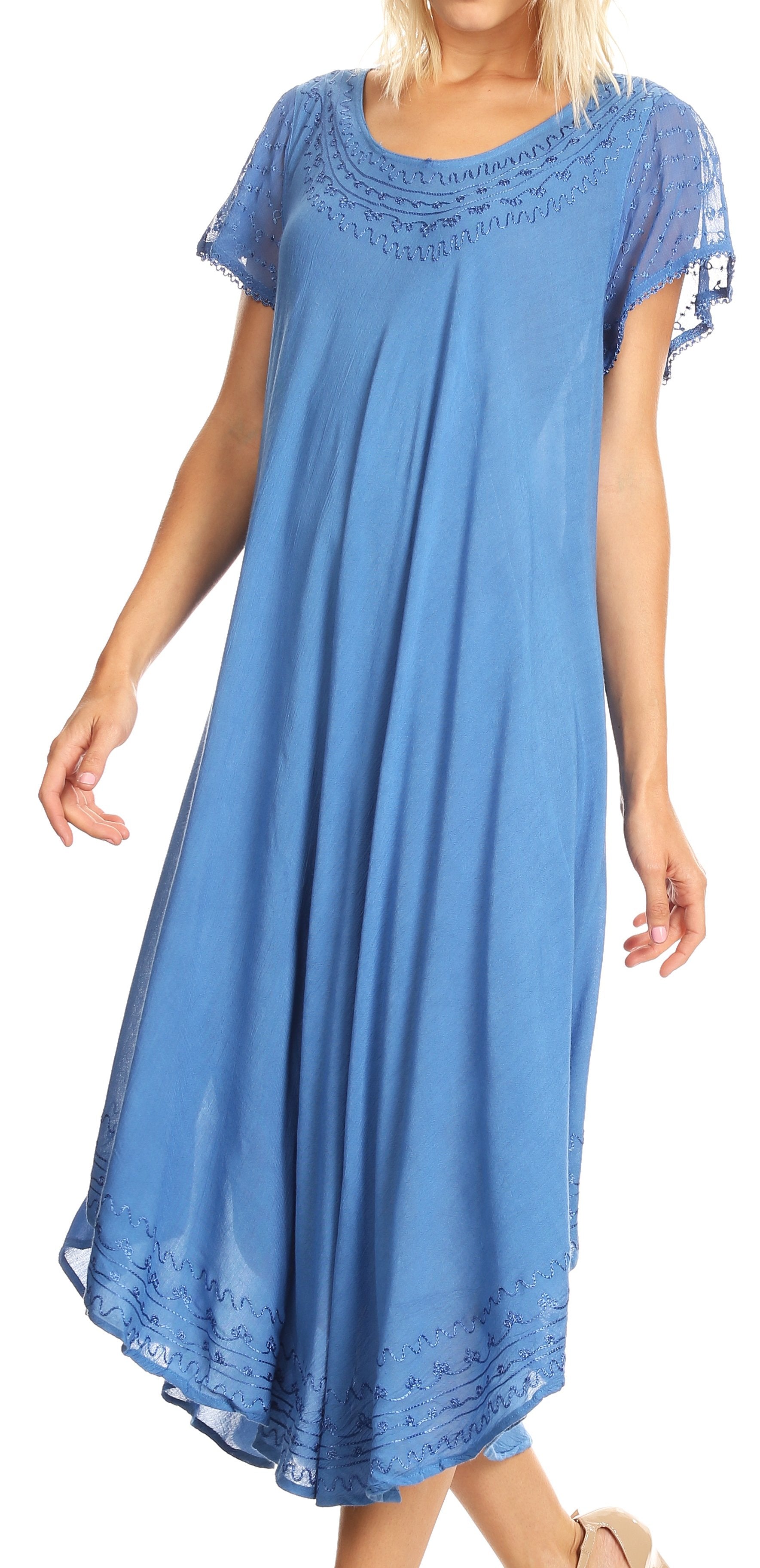 Woman wearing a blue dress with lace details on a white background
