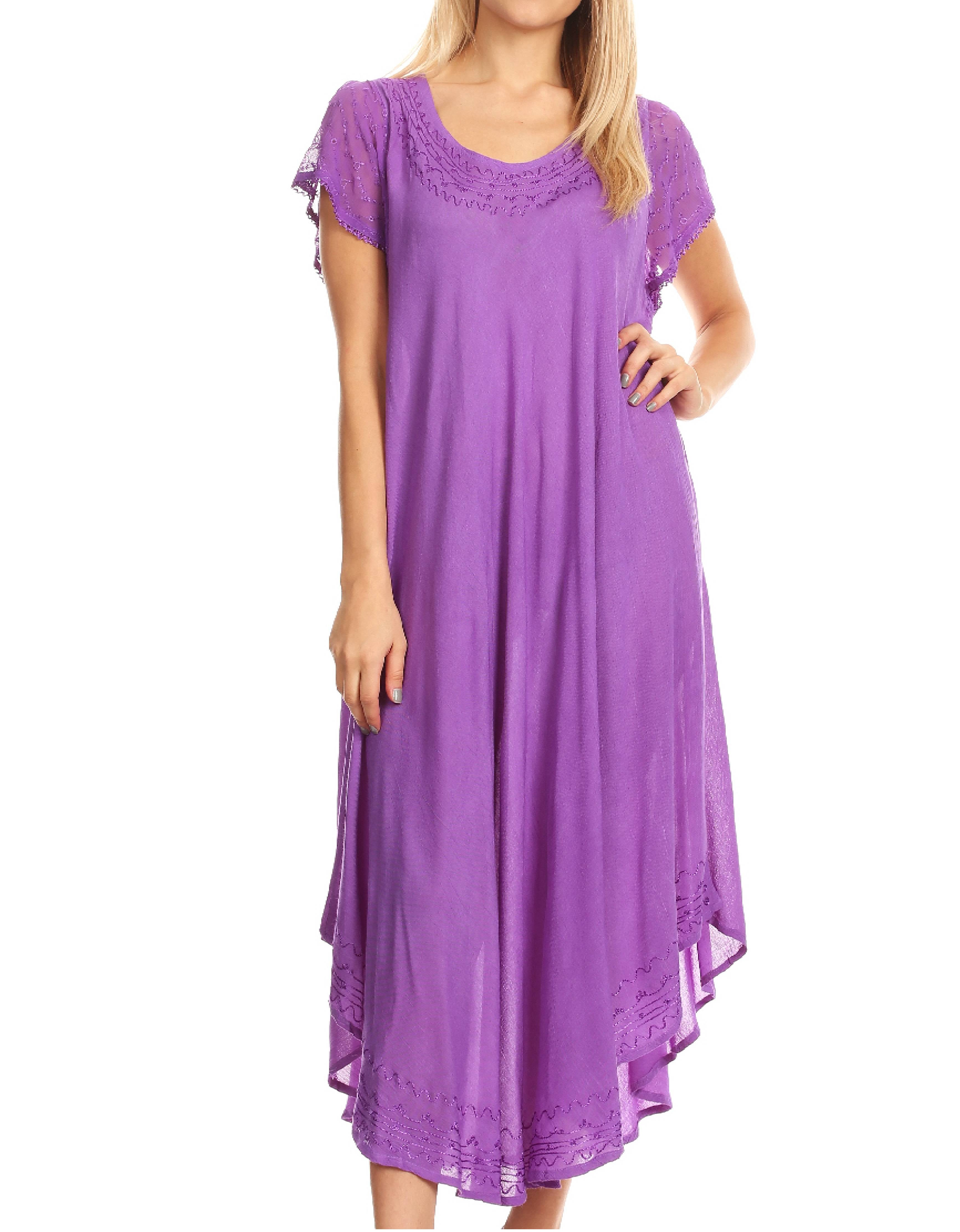 Woman wearing a purple dress with lace details on a white background