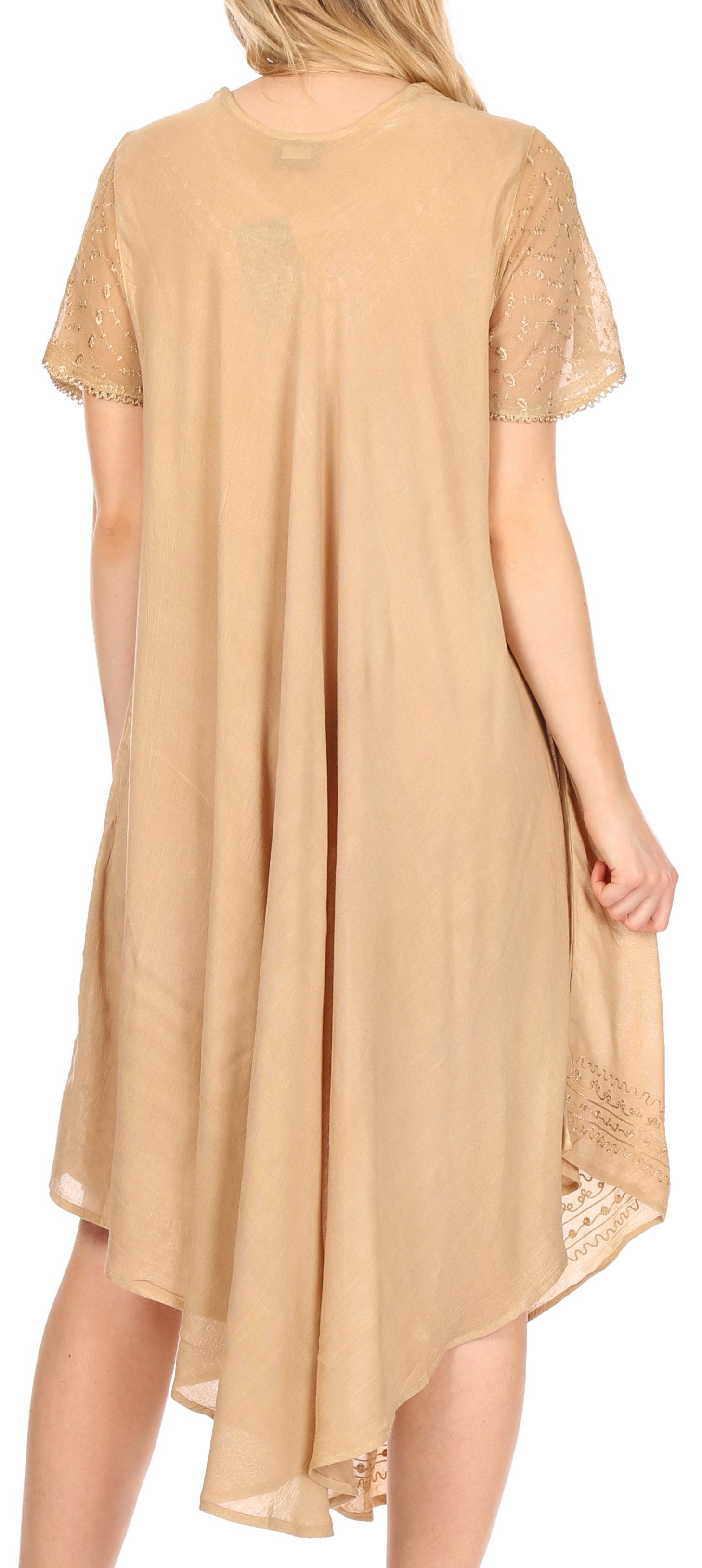 Beige lace-trimmed dress worn by a model on a white background