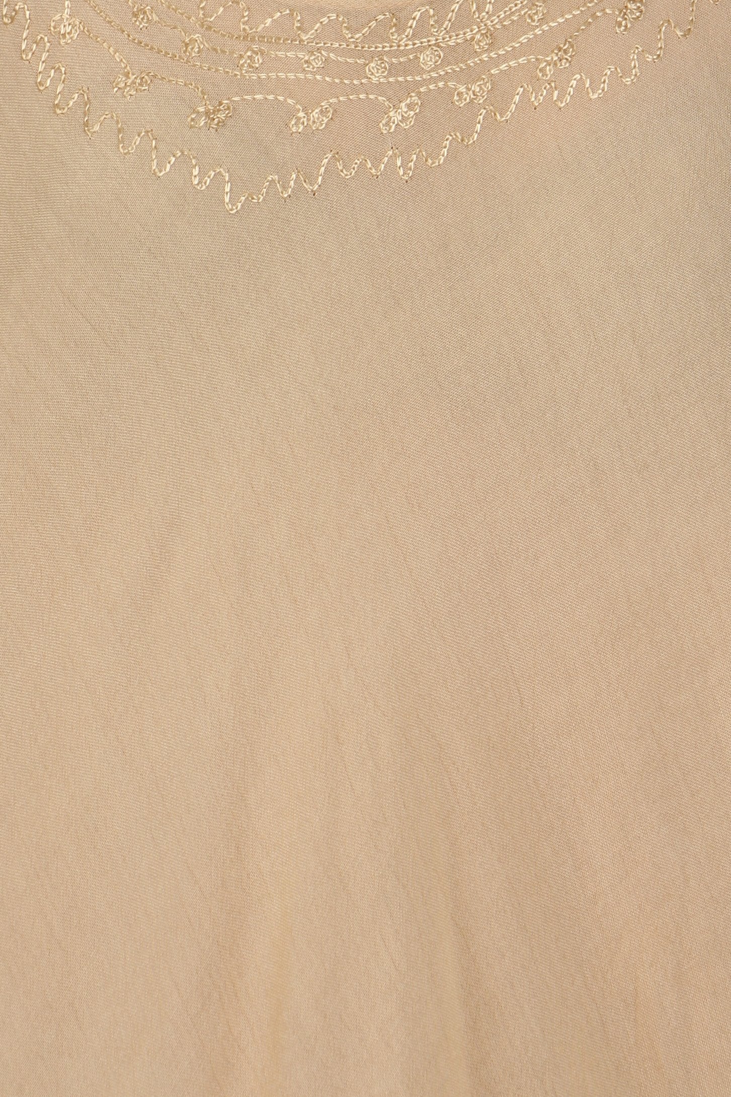 Beige fabric texture with decorative gold pattern at the top