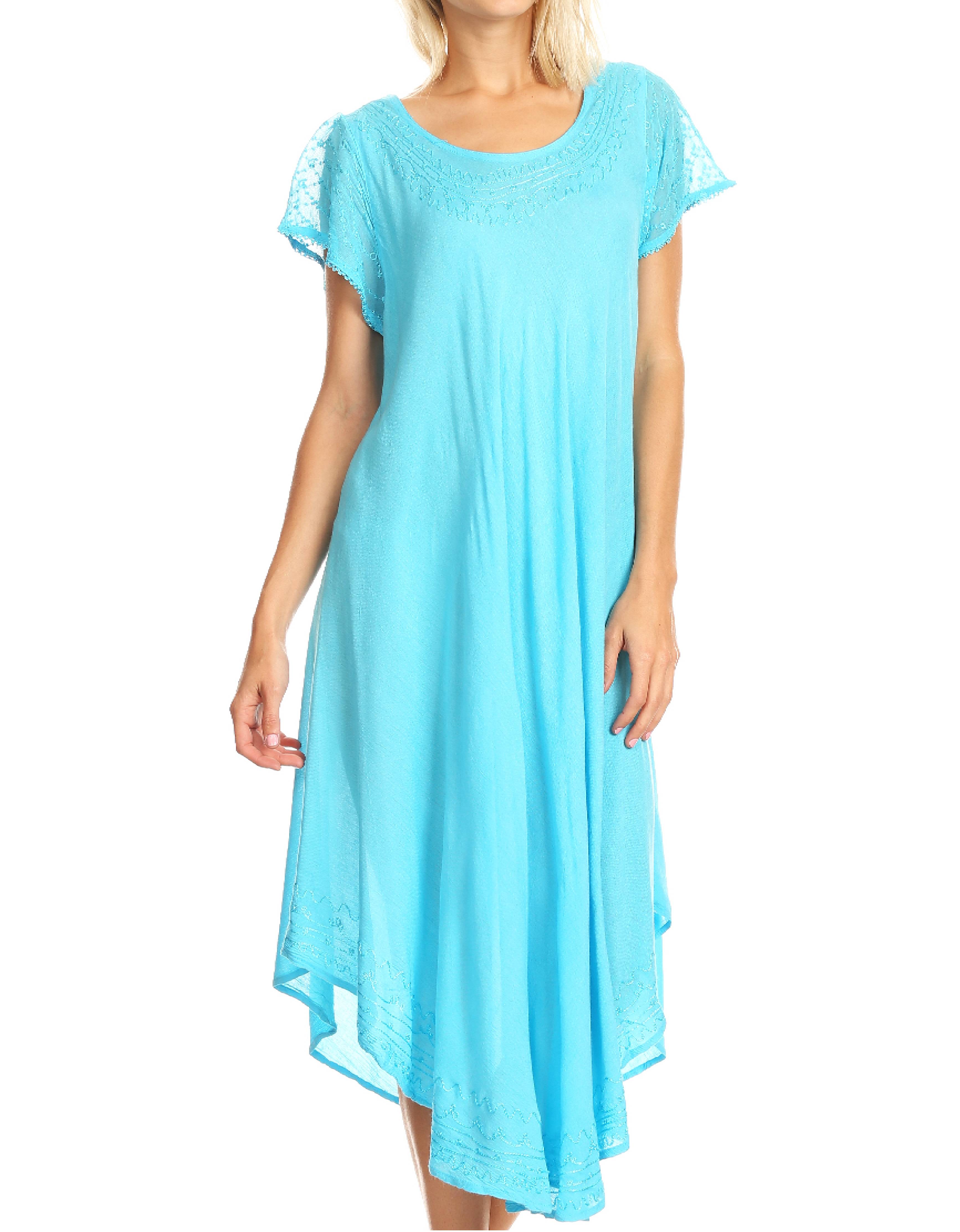 Woman wearing a light blue dress with lace sleeves on a white background