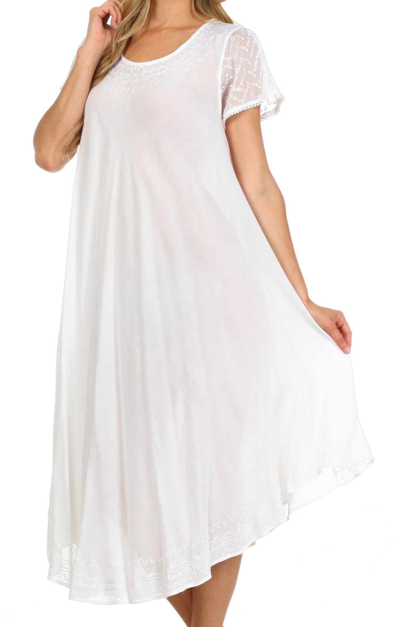 White dress with sheer sleeves worn by a model on a white background