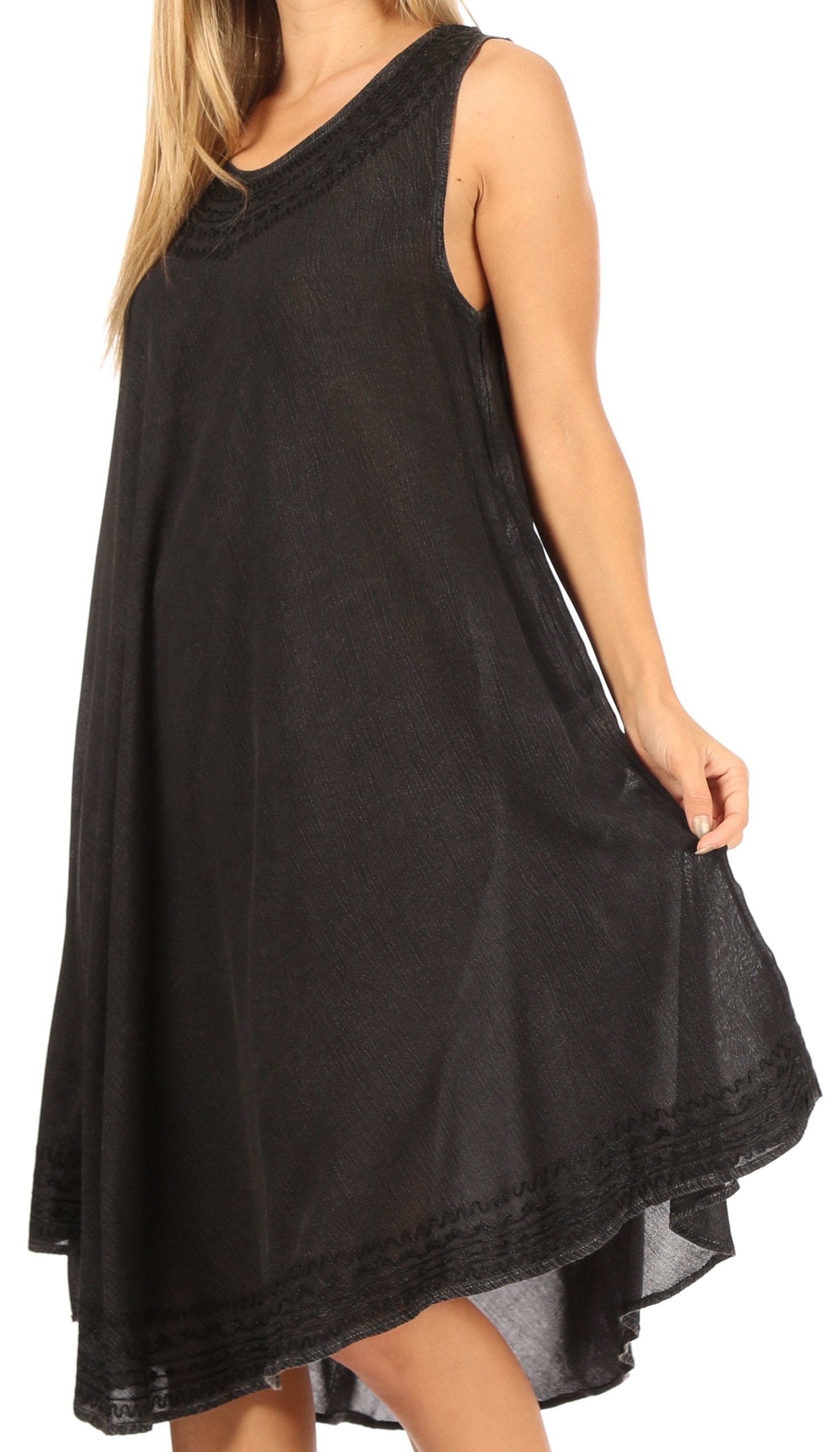 Black sleeveless dress worn by a model on a white background