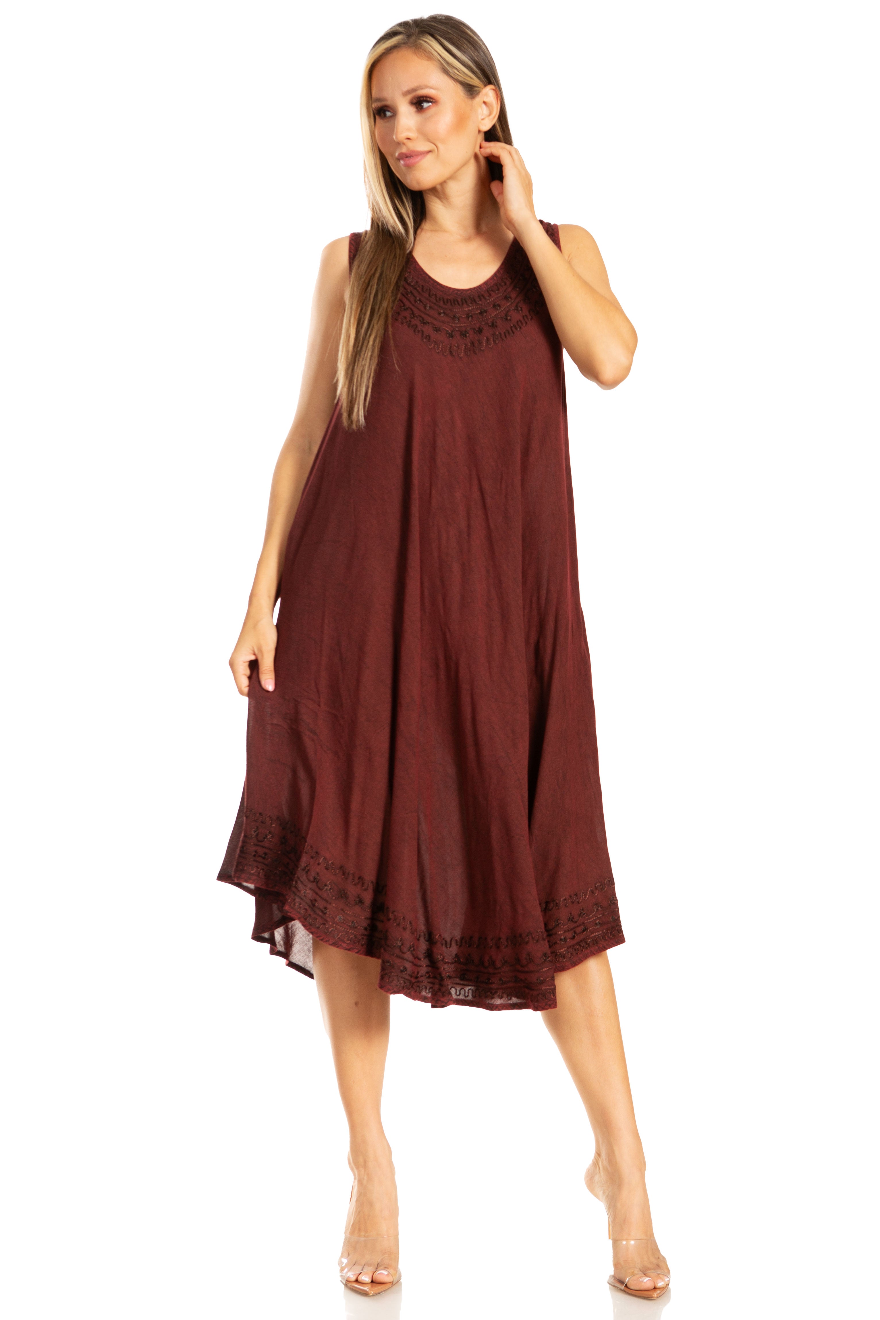Woman wearing a burgundy dress with lace details on a white background