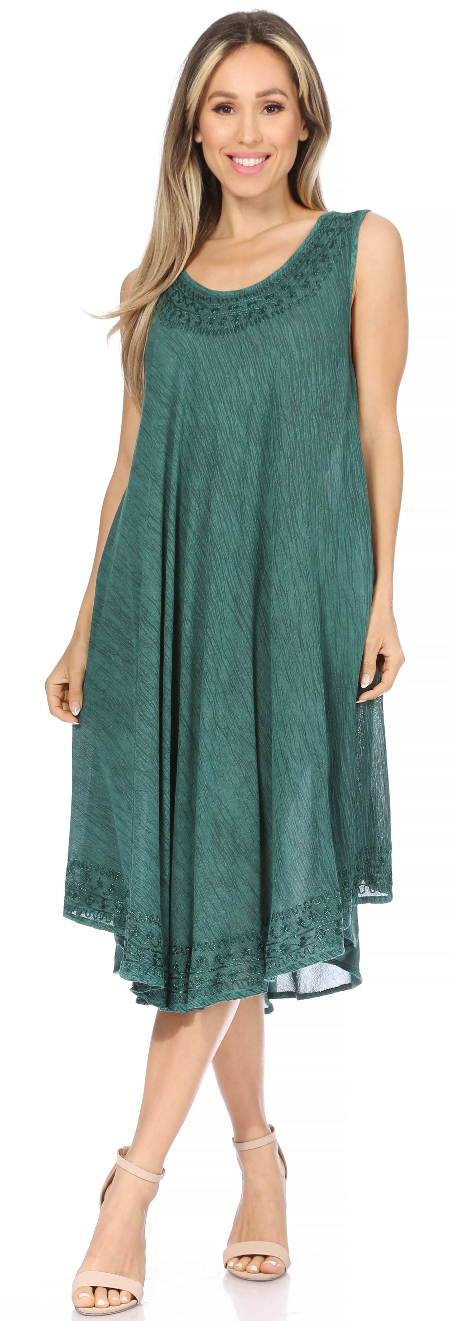 Woman wearing a green sleeveless dress on a white background
