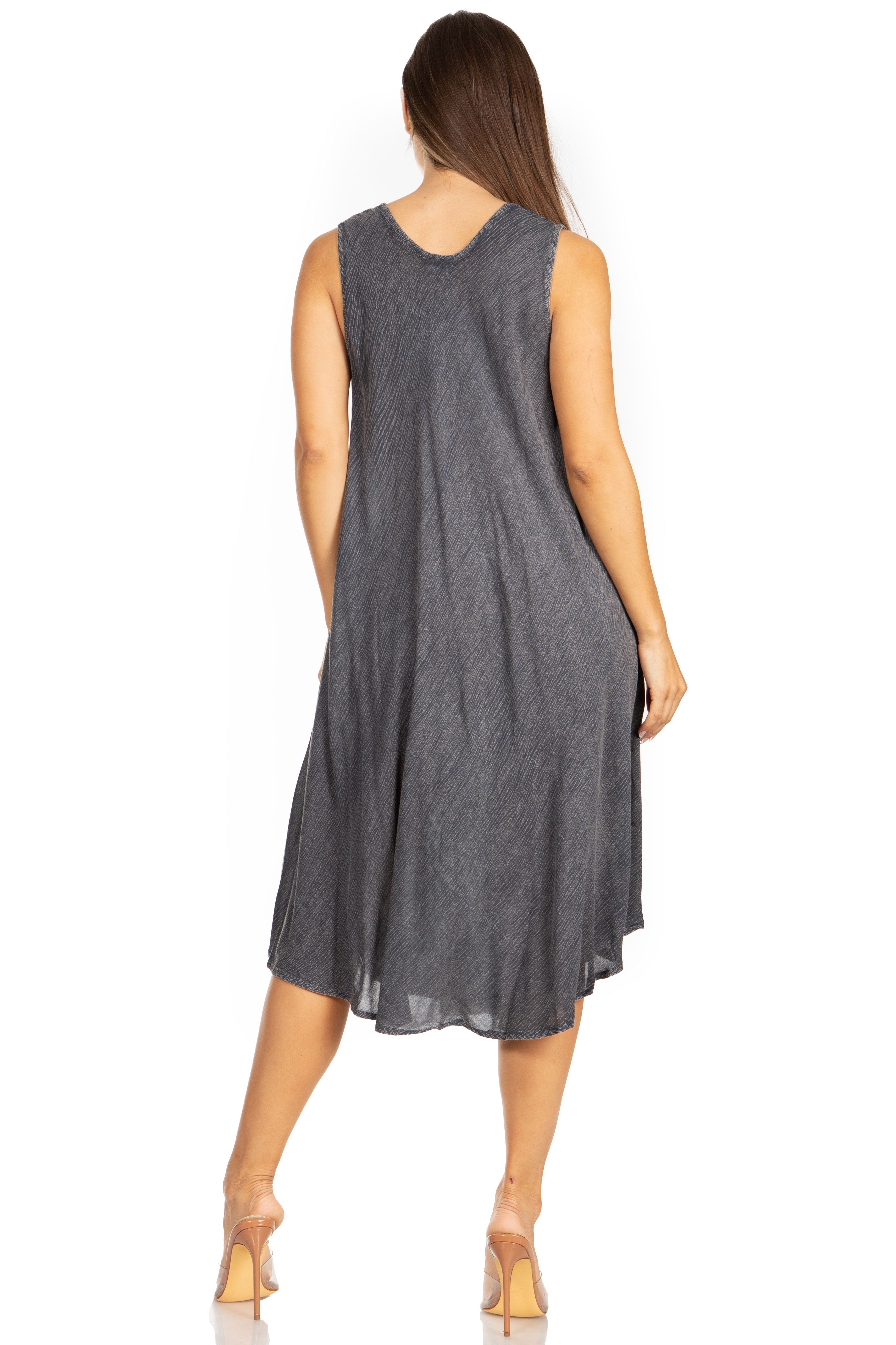 Woman wearing a gray sleeveless dress on a white background